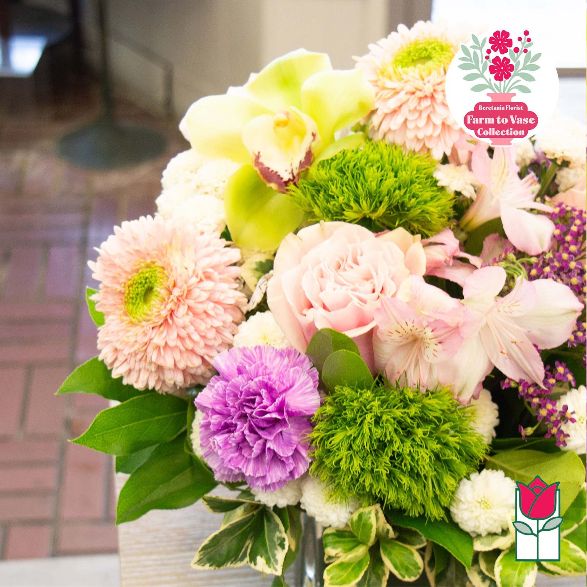 Mixed bouquet with pink, white, and green flowers