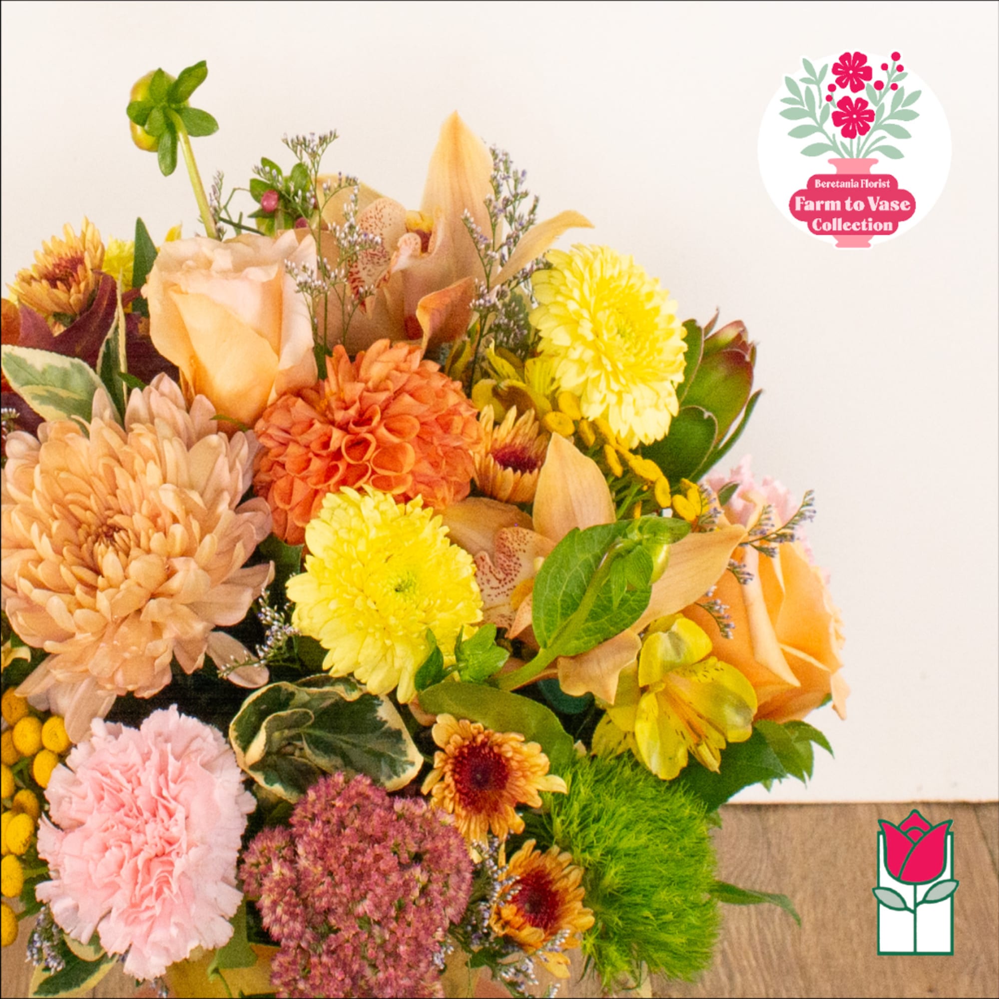 Mixed bouquet with peach, yellow, and pink flowers