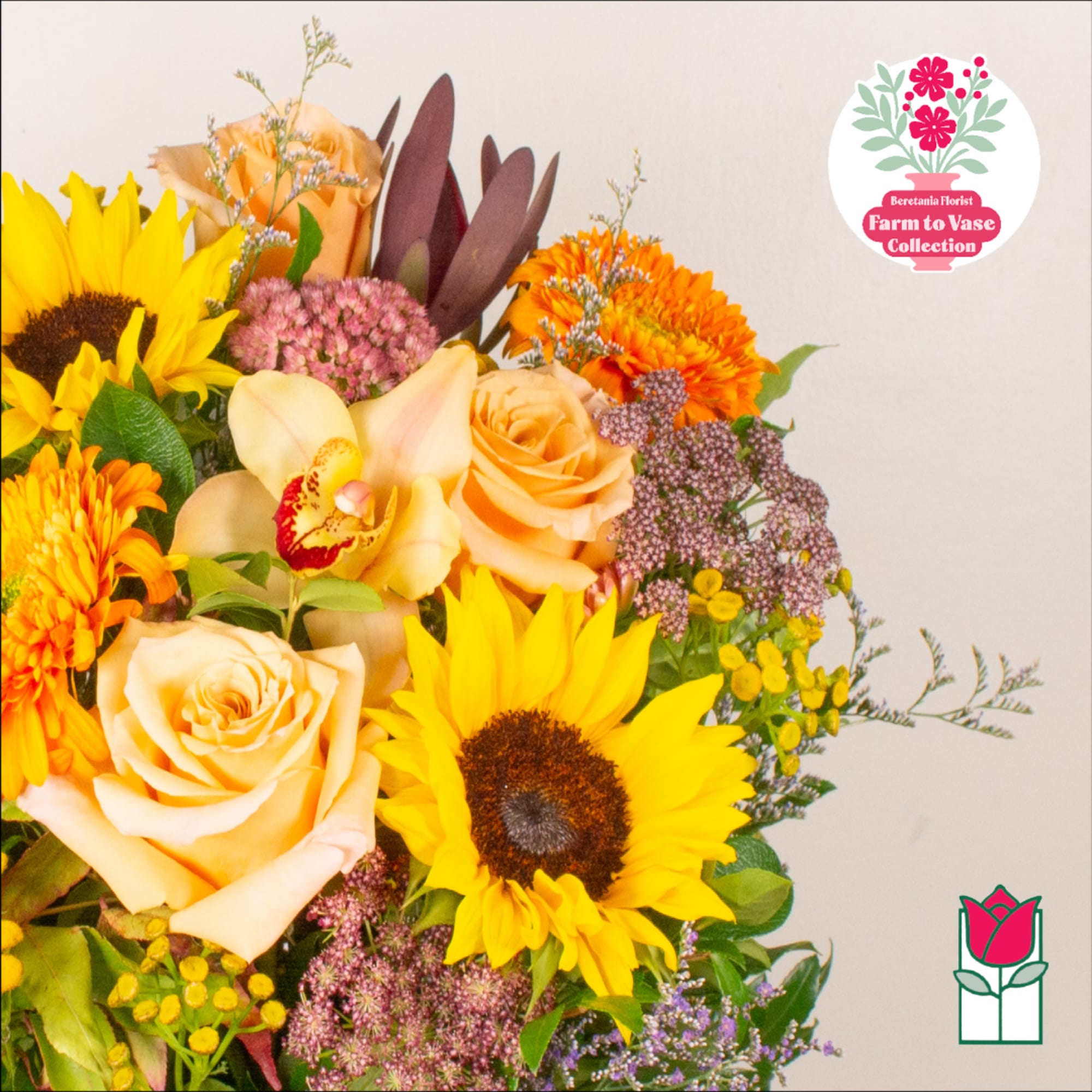 Bouquet with sunflowers, peach roses, and orange blooms