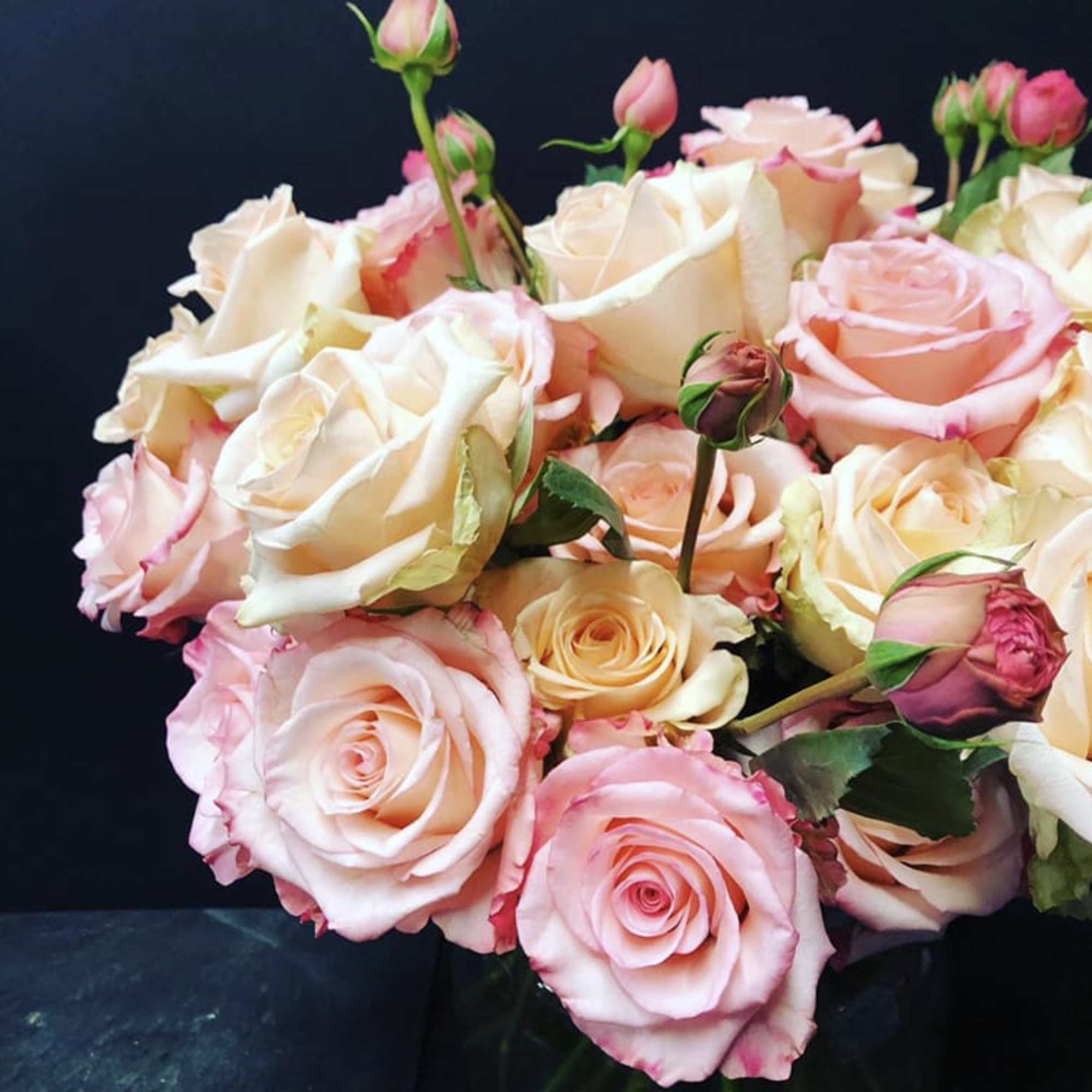 Bouquet of pale pink and cream roses with rosebuds
