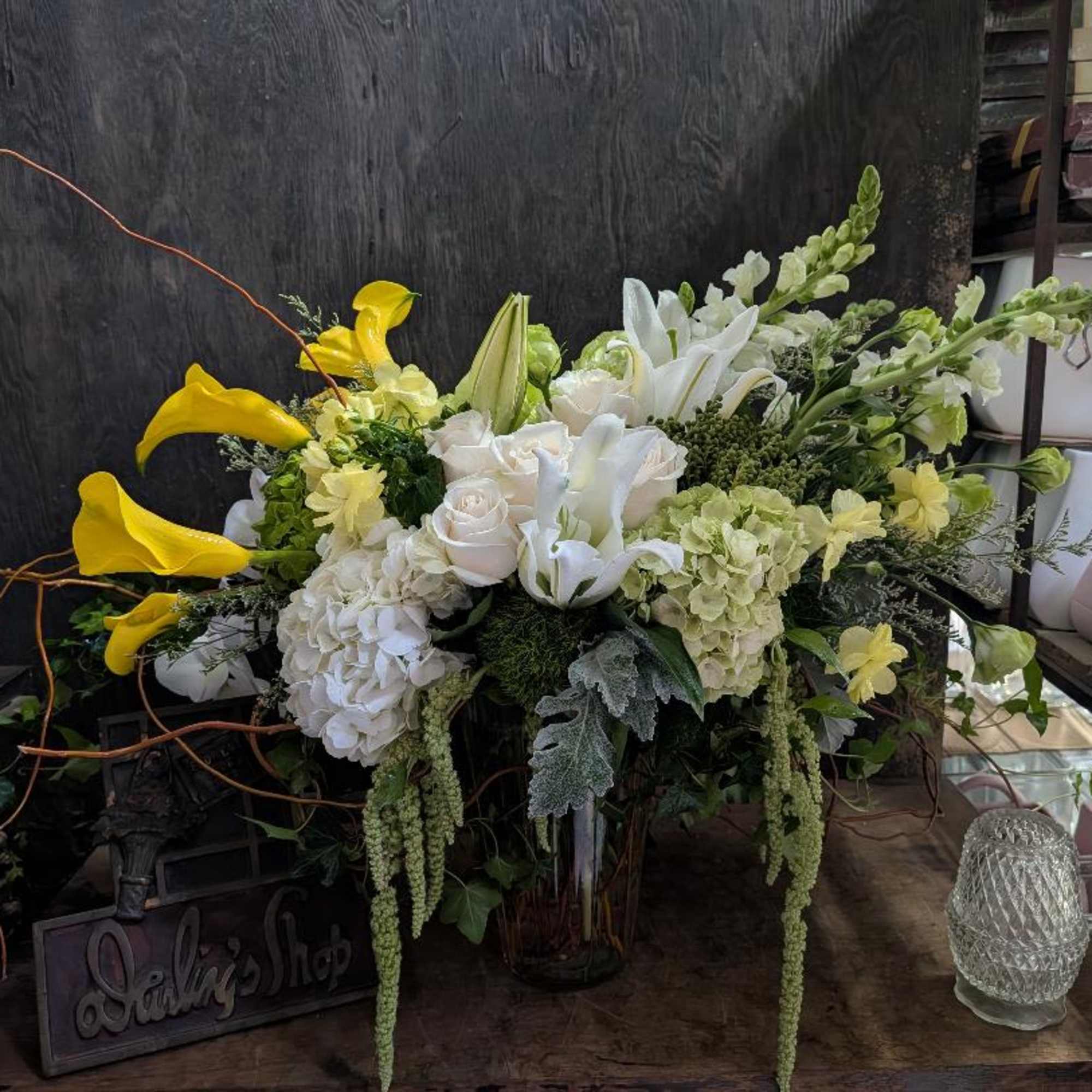 A lovely arrangement that includes, roses, hydrangeas, callas, lisianthus,  and much