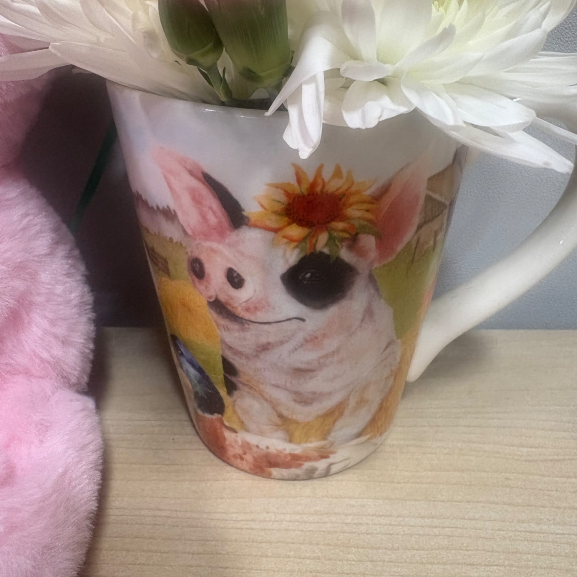 White flowers in a mug with a dog illustration