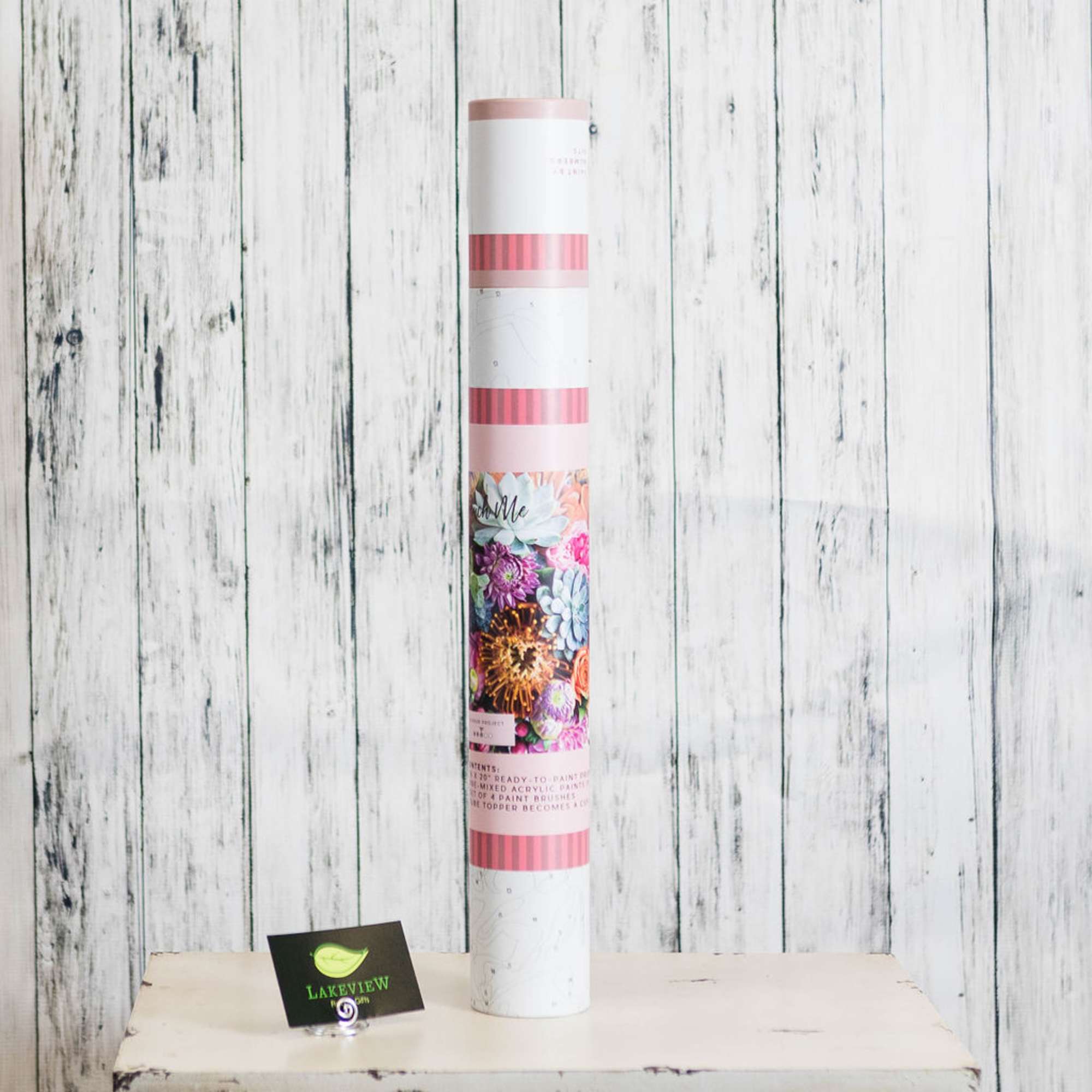 Tall floral gift tube with colorful flower artwork