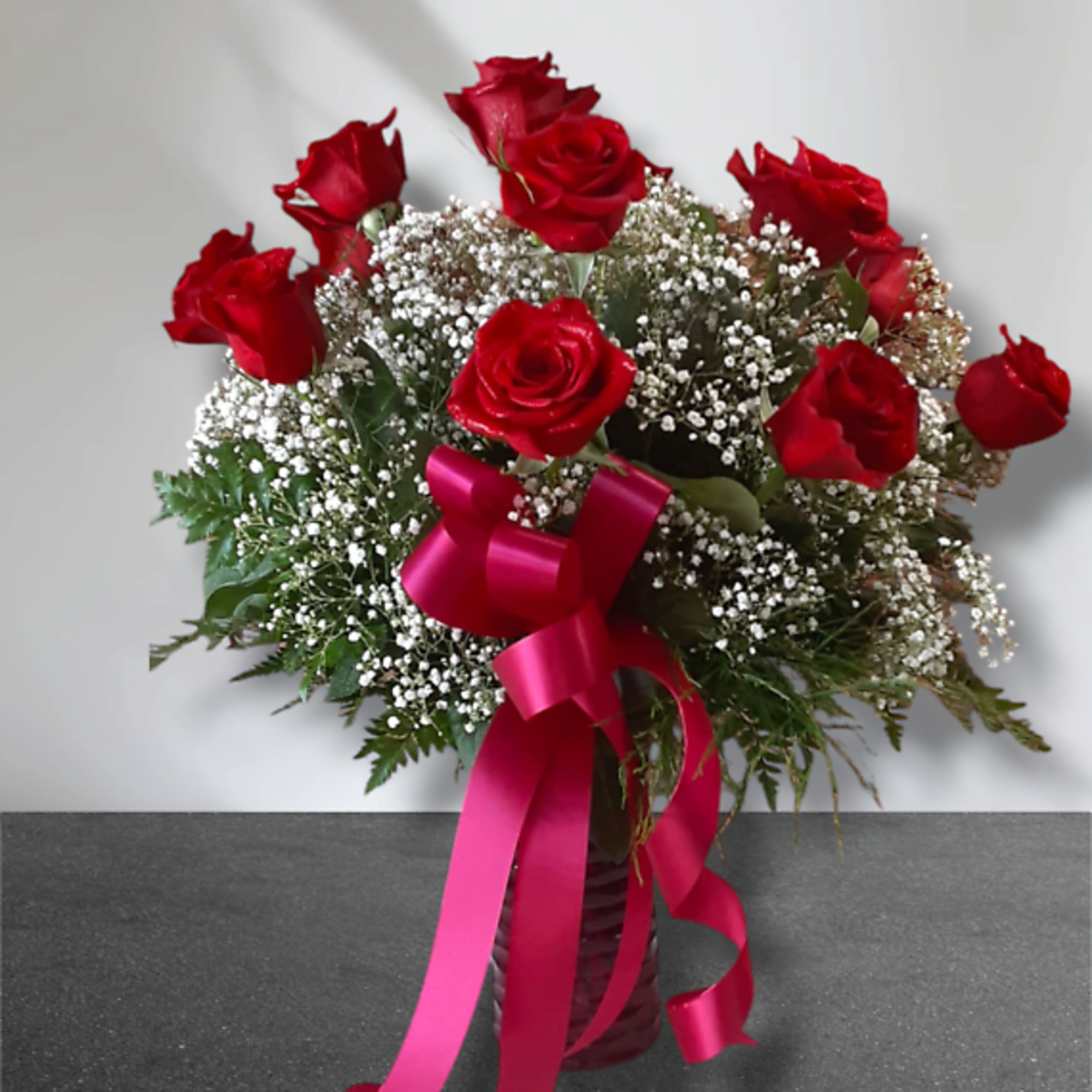 Timeless and romantic, this classic dozen of long-stemmed premium roses is the