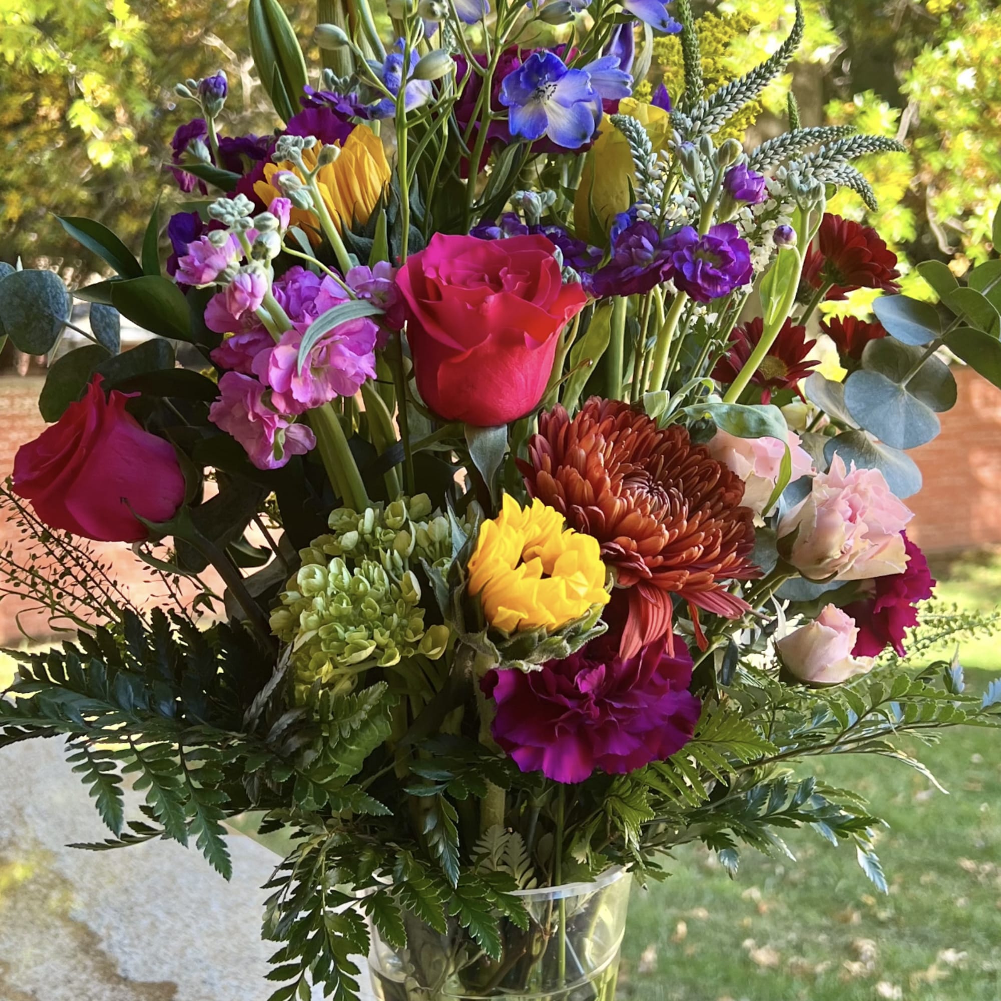 Colorful mixed bouquet in a clear glass vase