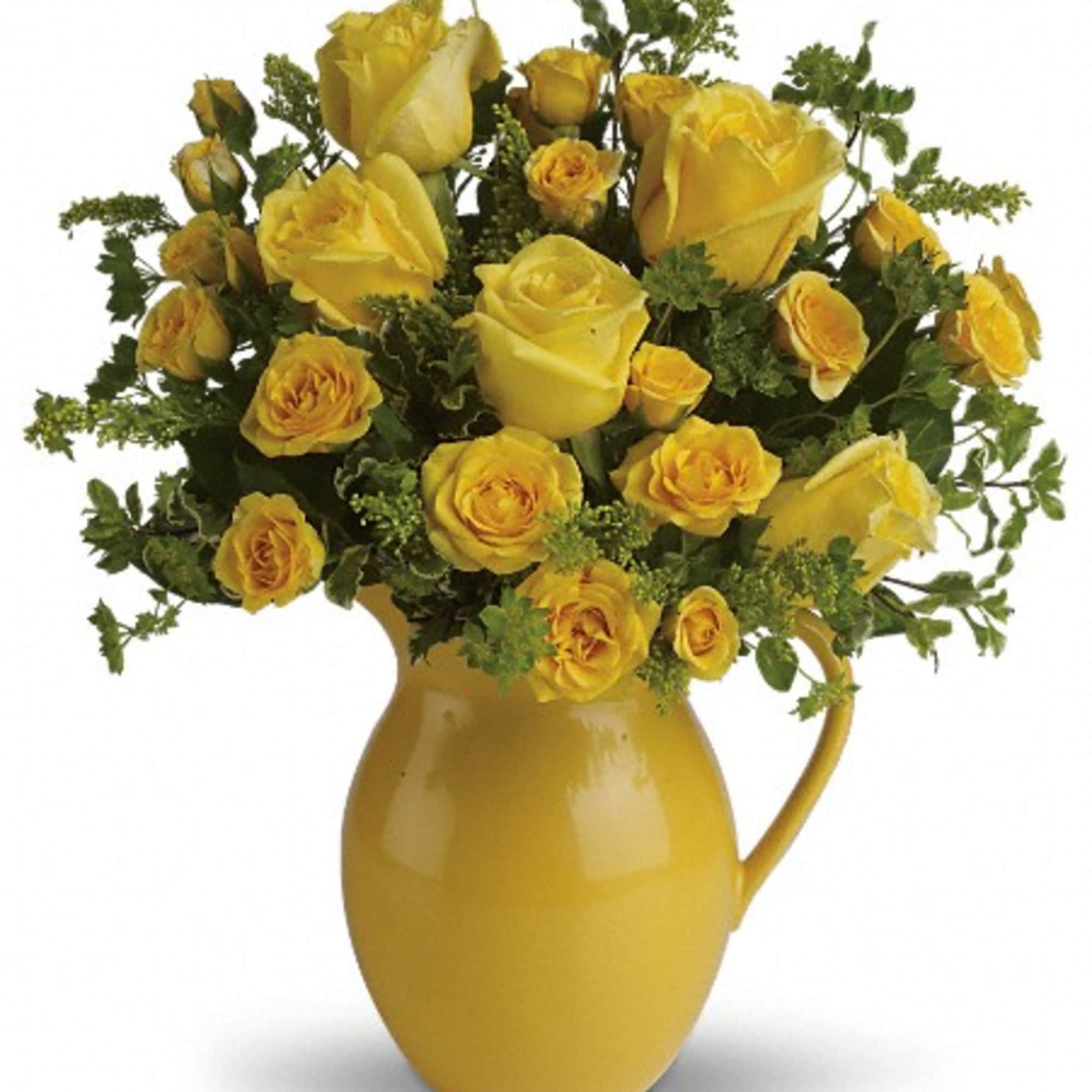 Yellow roses arranged in a yellow pitcher vase, photo 2 of 3