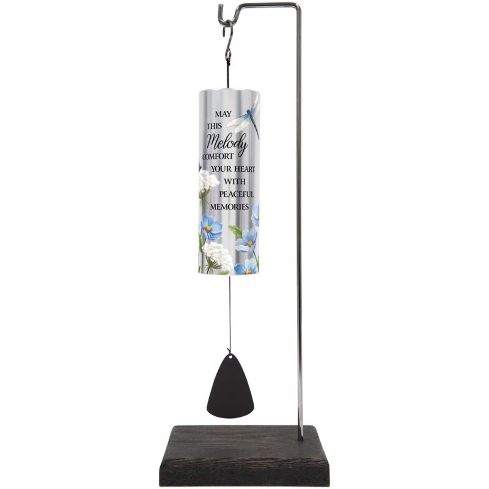 Memorial wind chime with blue floral print and a black clapper on a stand