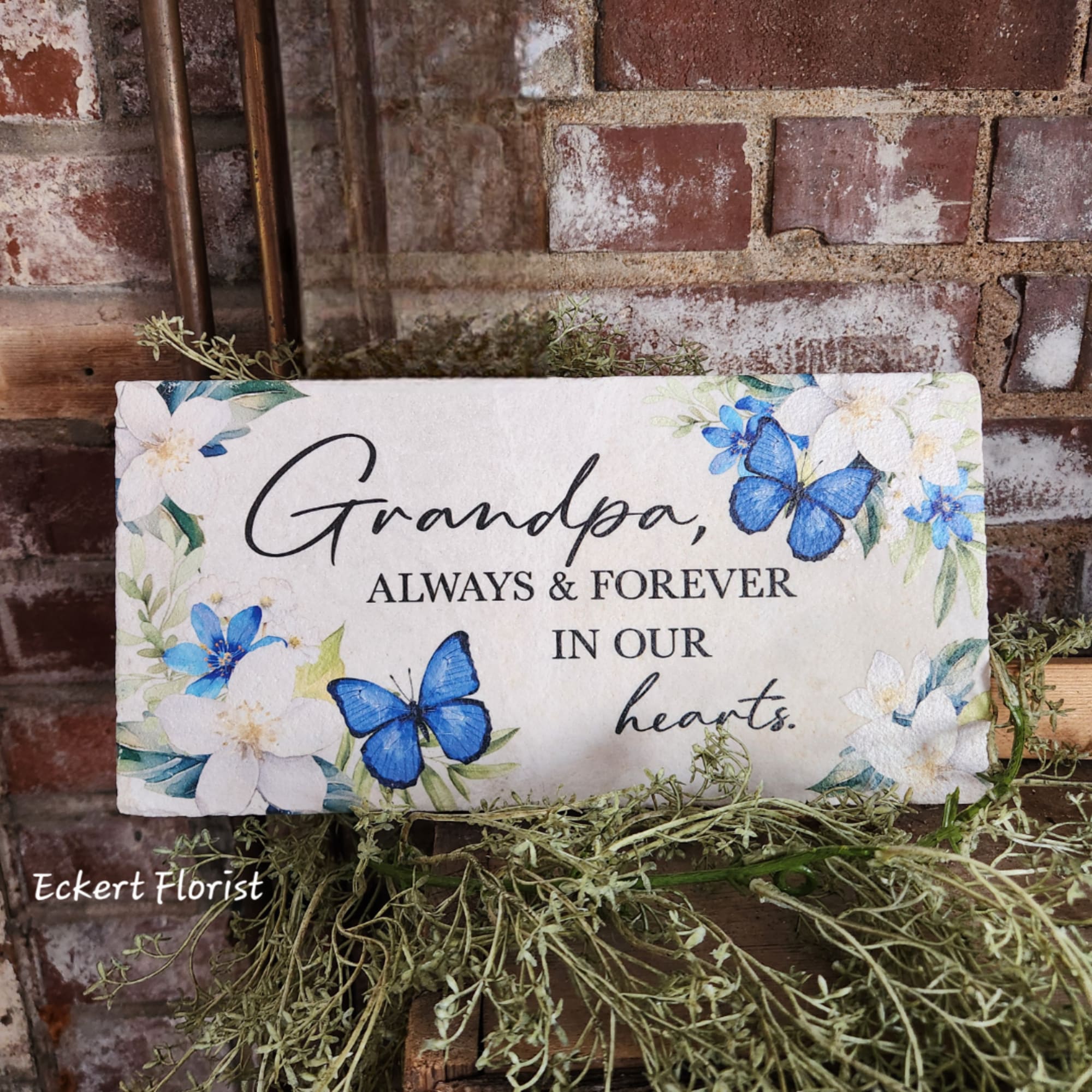 Decorative sympathy plaque with blue butterflies and flowers reading "Grandpa, always & forever in our hearts."