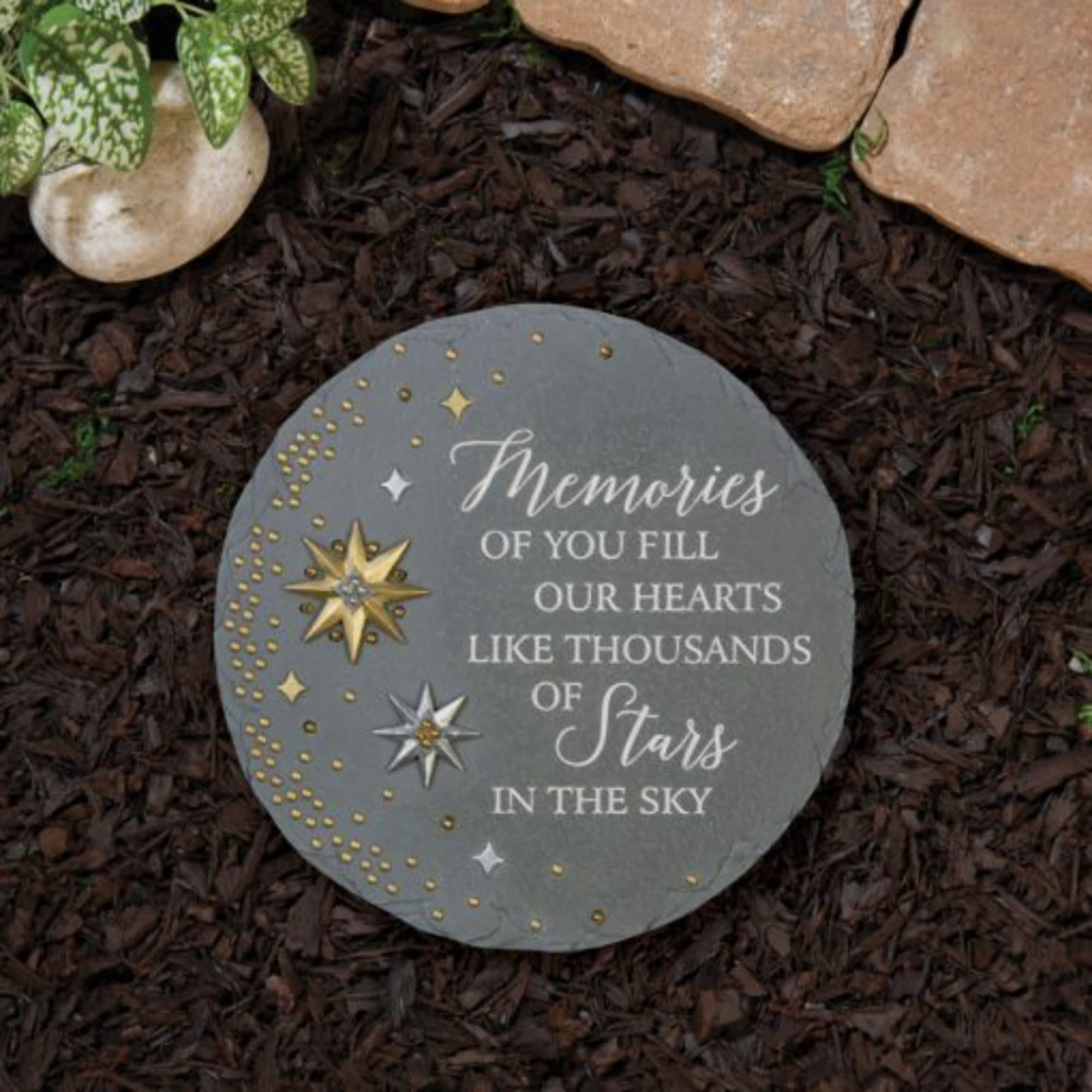 Round memorial stone with star design and remembrance text