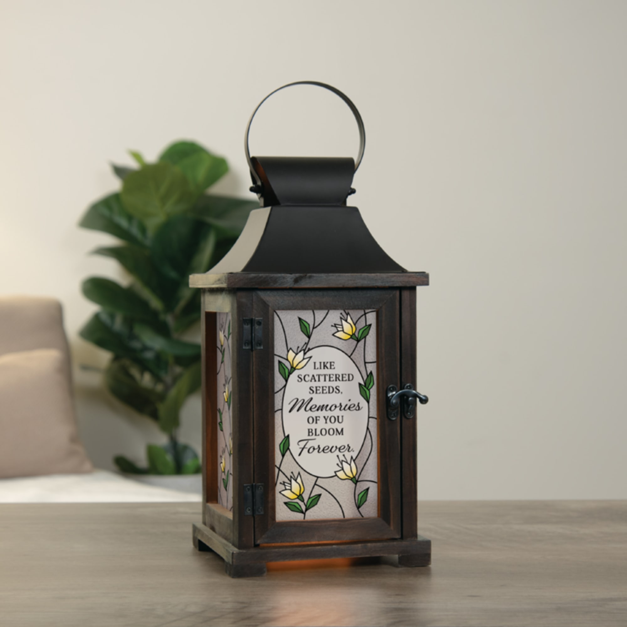 Decorative wooden lantern with a memorial quote and floral panels