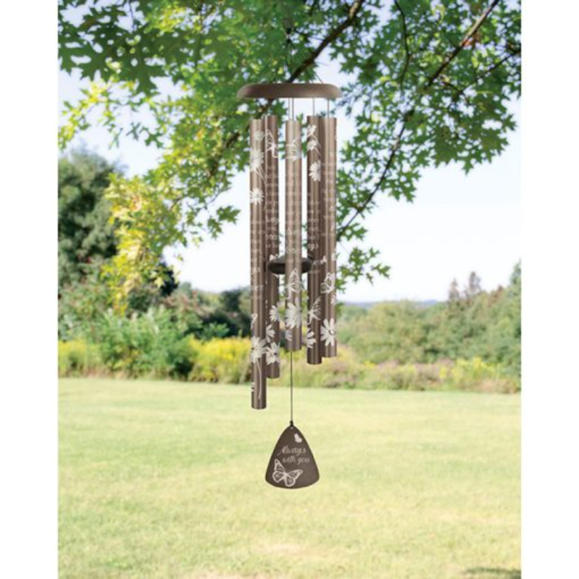 Brown wind chime hanging outdoors with a butterfly pendant