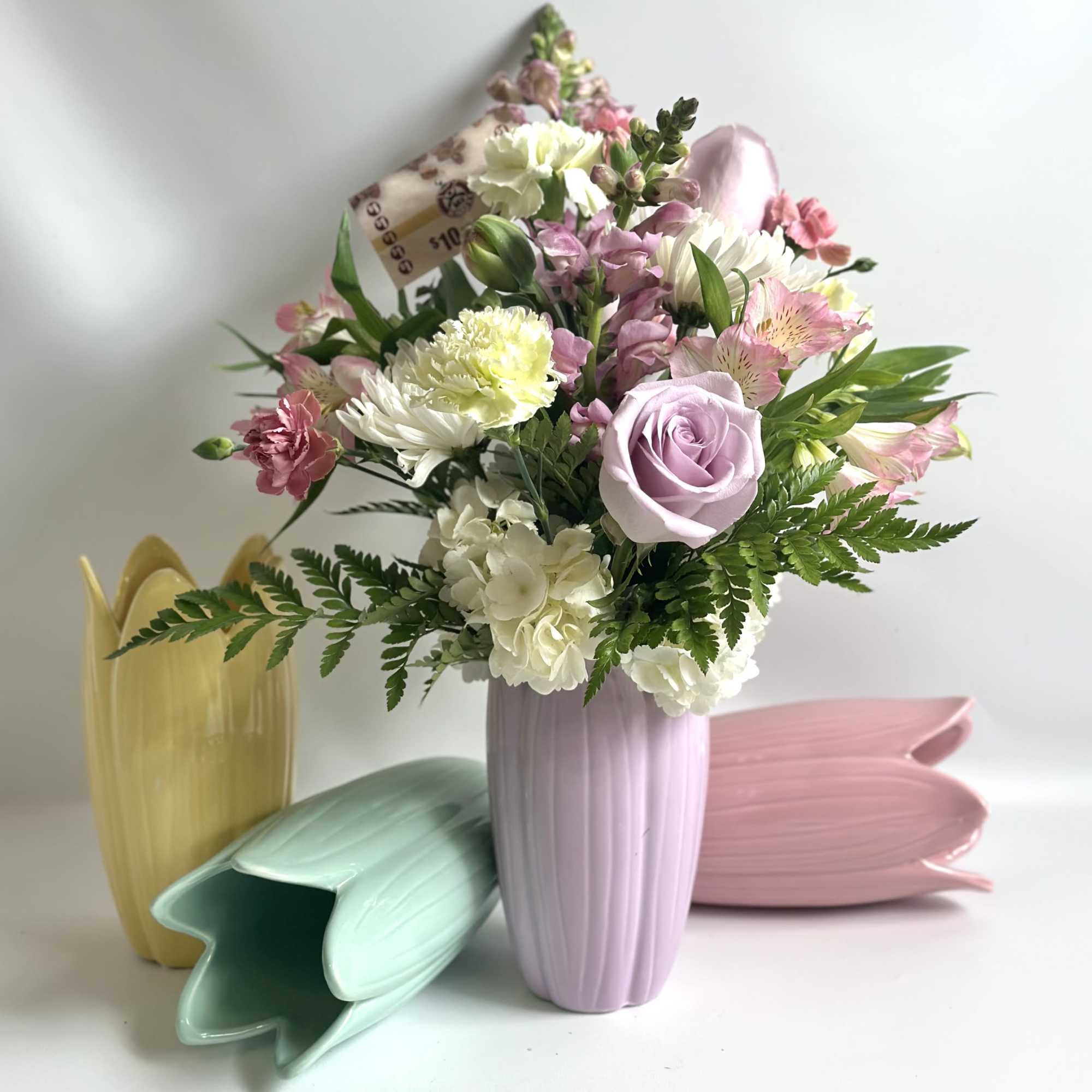 This beautiful ceramic Tulip vase is filled with roses, hydrangea, tulips, carnations