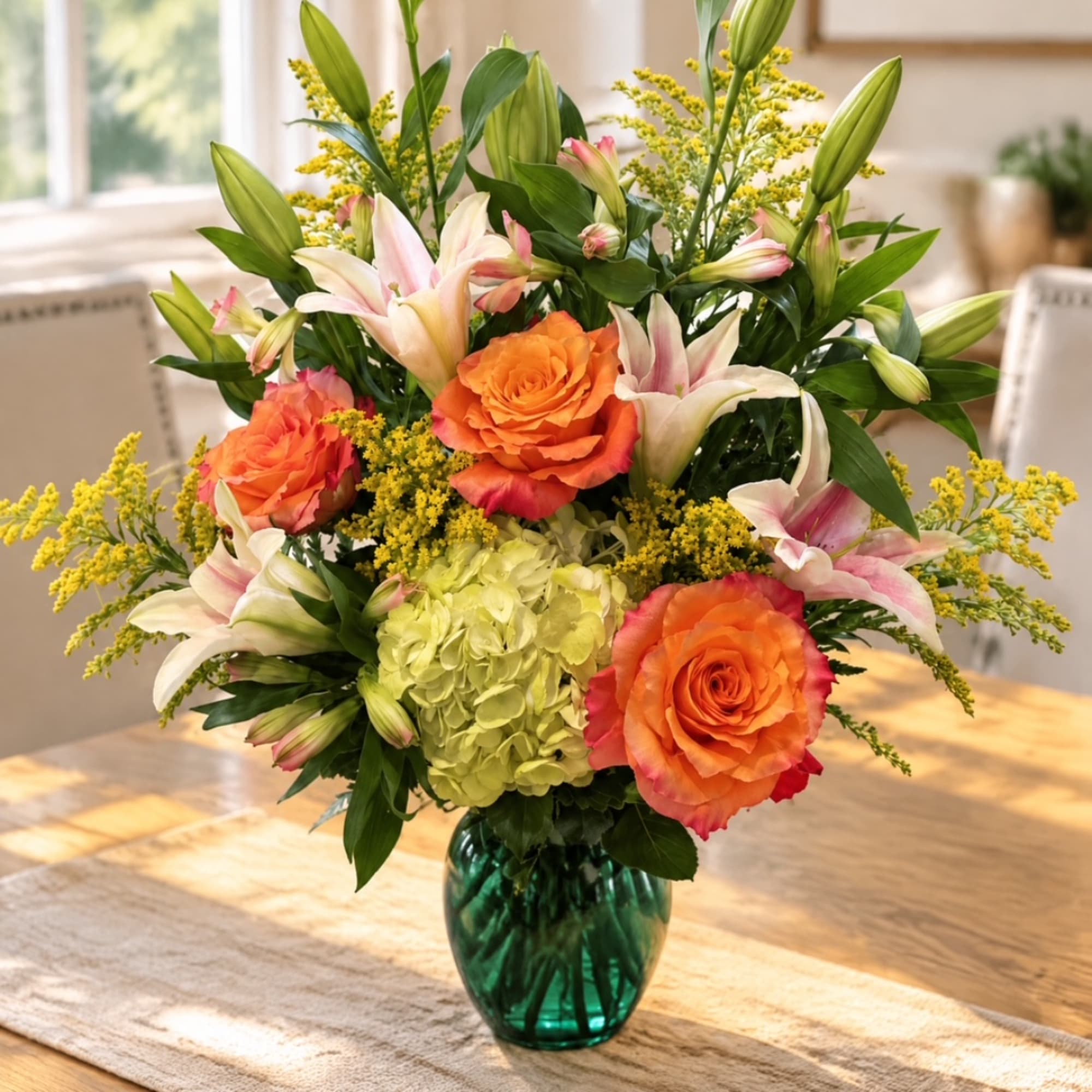 Bouquet of orange roses, lilies, and yellow filler in a green glass vase, photo 4 of 4