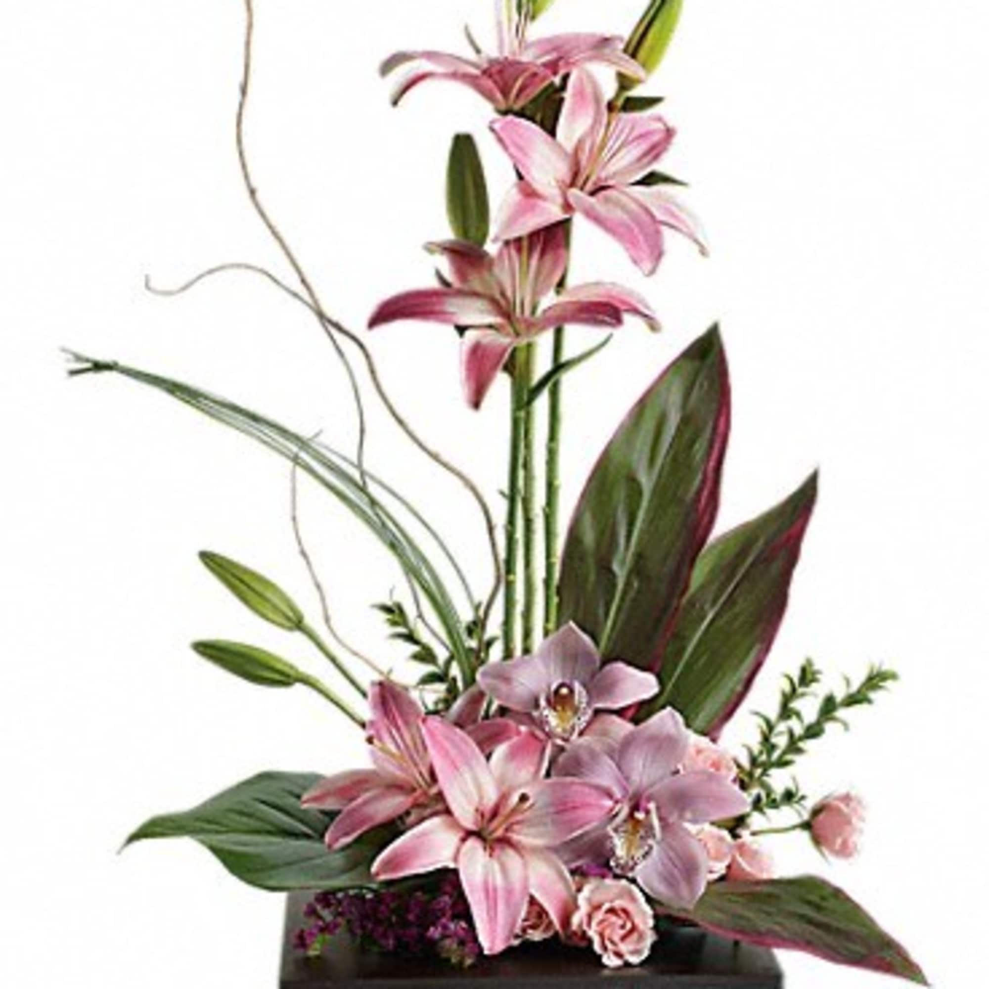 This towering topiary of asiatic lilies, orchids and roses - artistically arranged