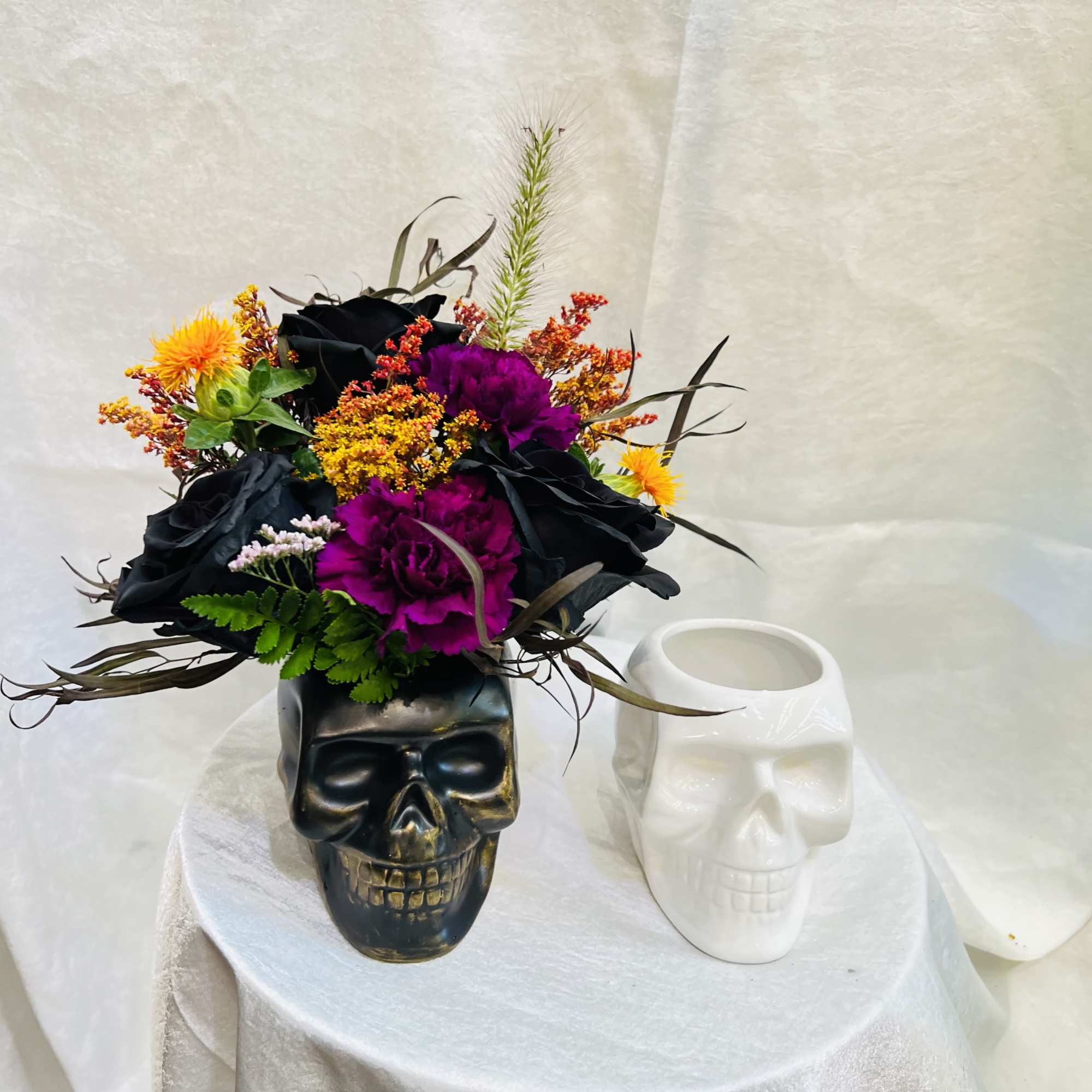Beautiful ceramic skull container with dark color flowers.
please note in the special, photo 3 of 3