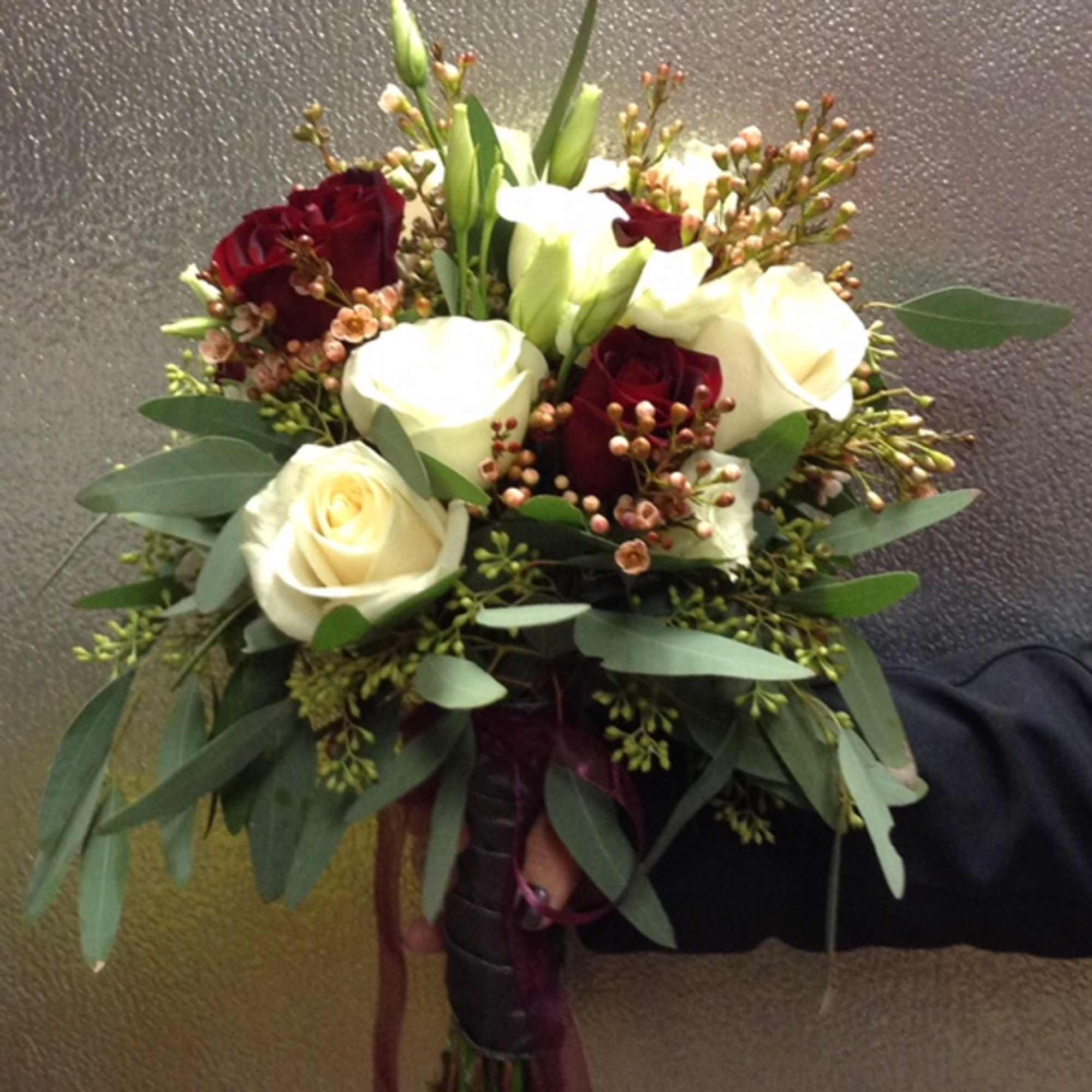let us custom arrange your wedding bouquet . Give us a call