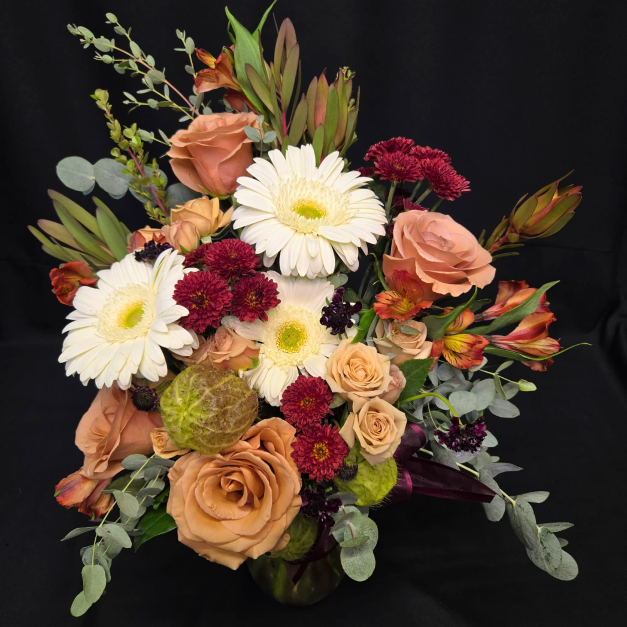 Bouquet of peach roses, white gerbera daisies, and burgundy mums