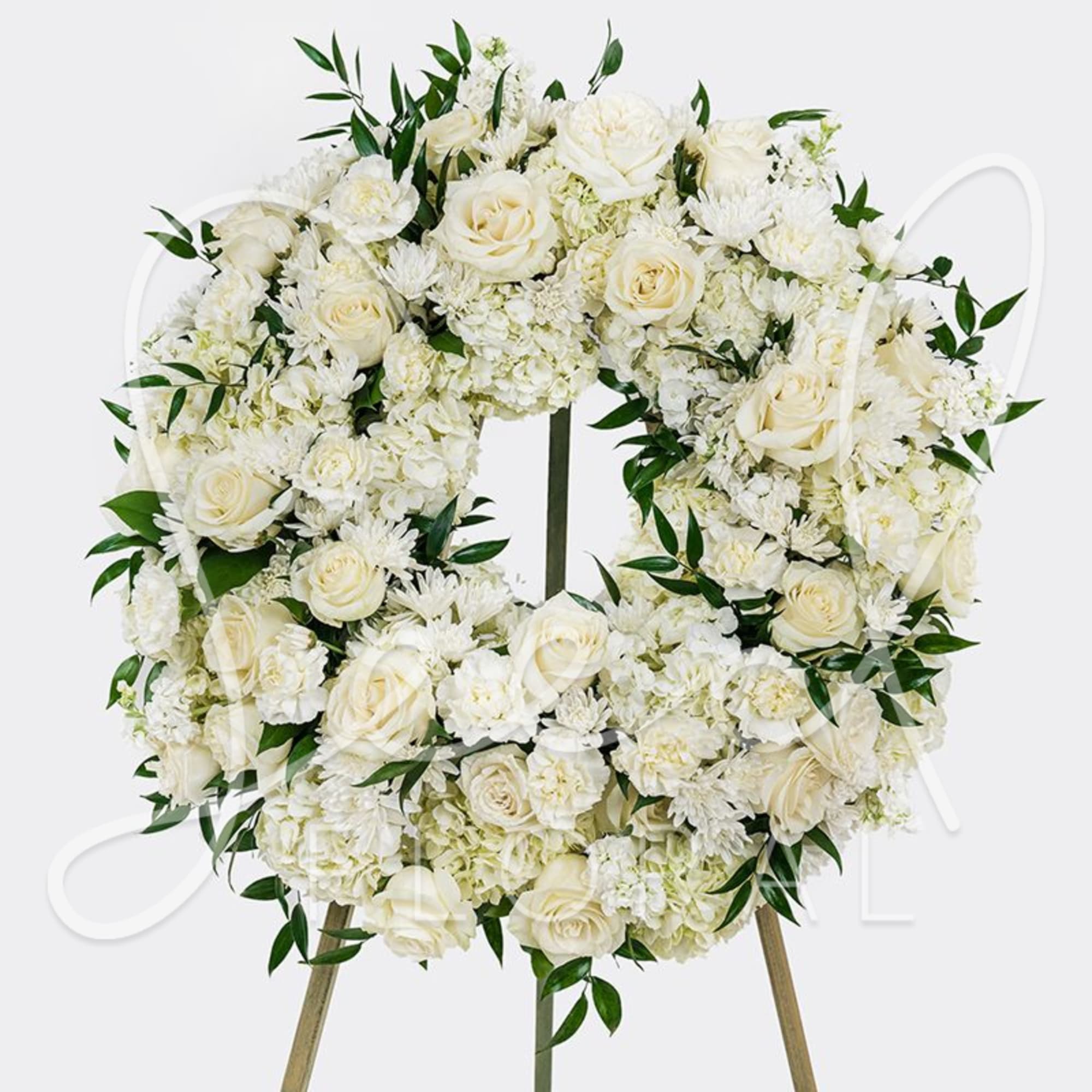 White floral wreath on a standing easel, photo 3 of 3