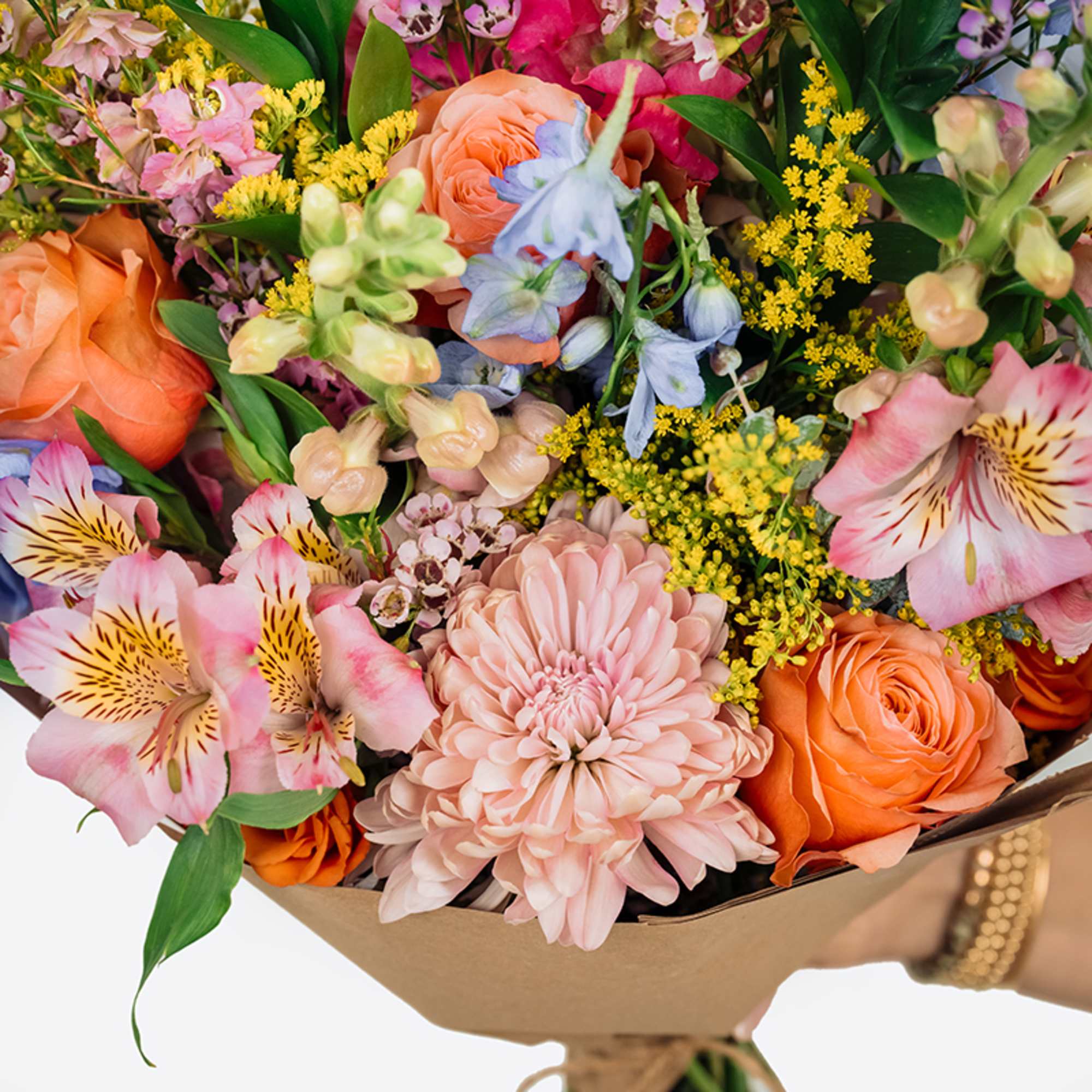 Mixed bouquet of orange roses, pink chrysanthemums, and alstroemeria