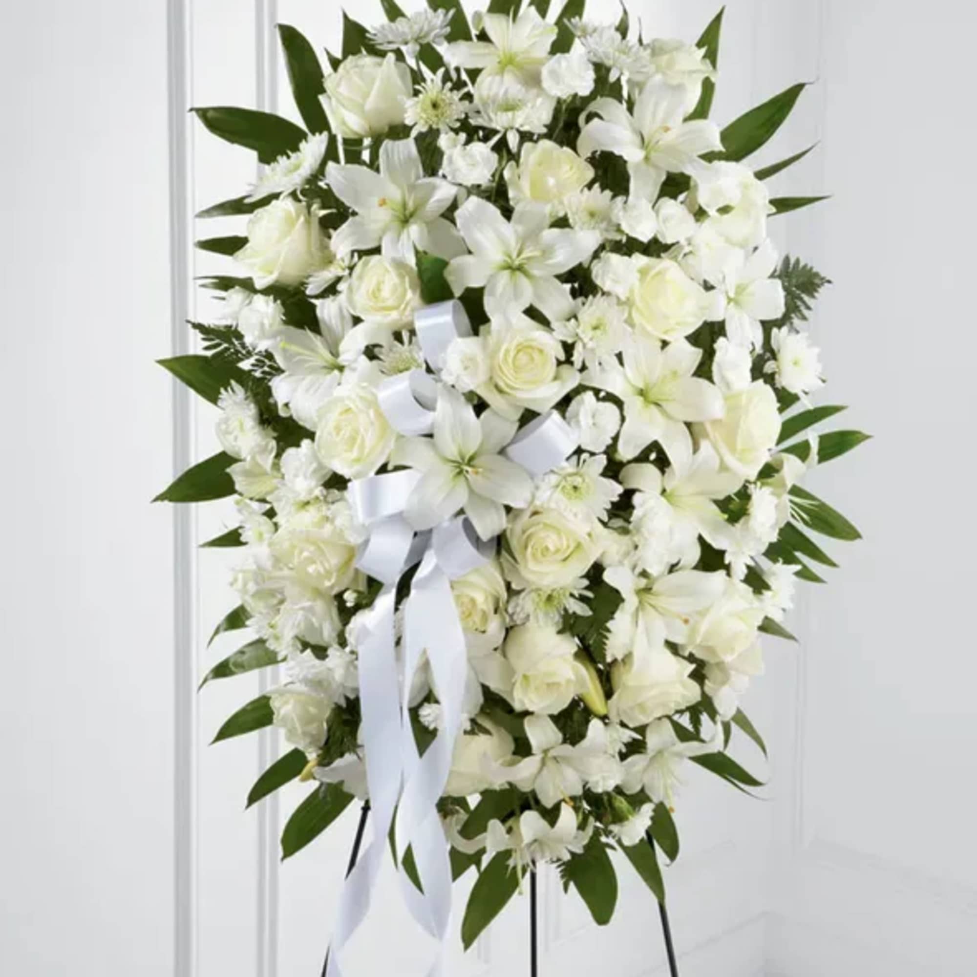 The FTD Exquisite Tribute Standing Spray is an elegant display of sweet