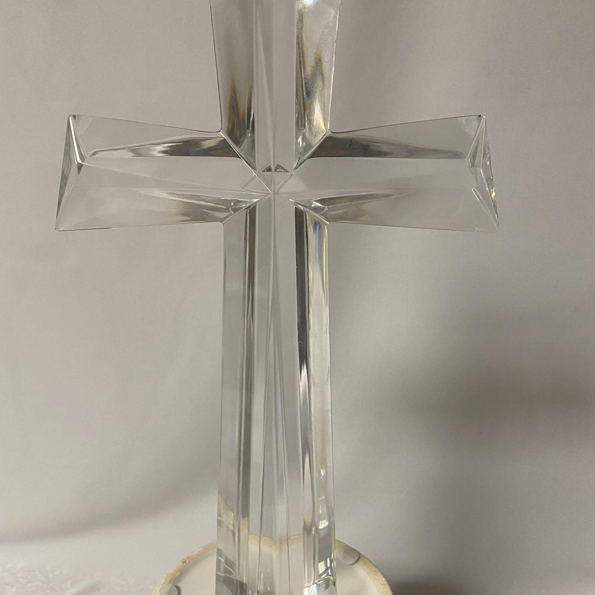 Clear glass cross on a round base