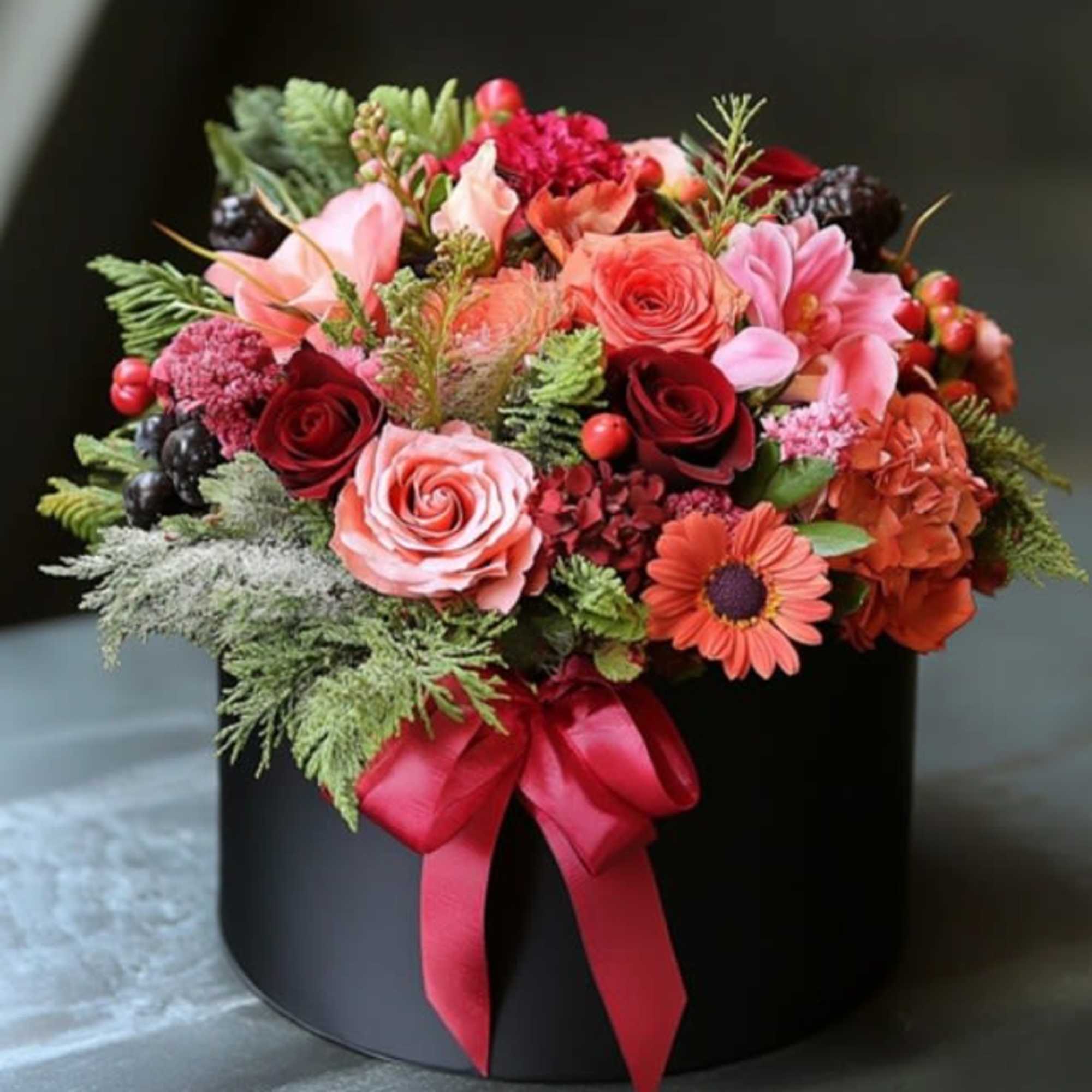 Perfect as a Christmas gift. This hat box arrangement is made special