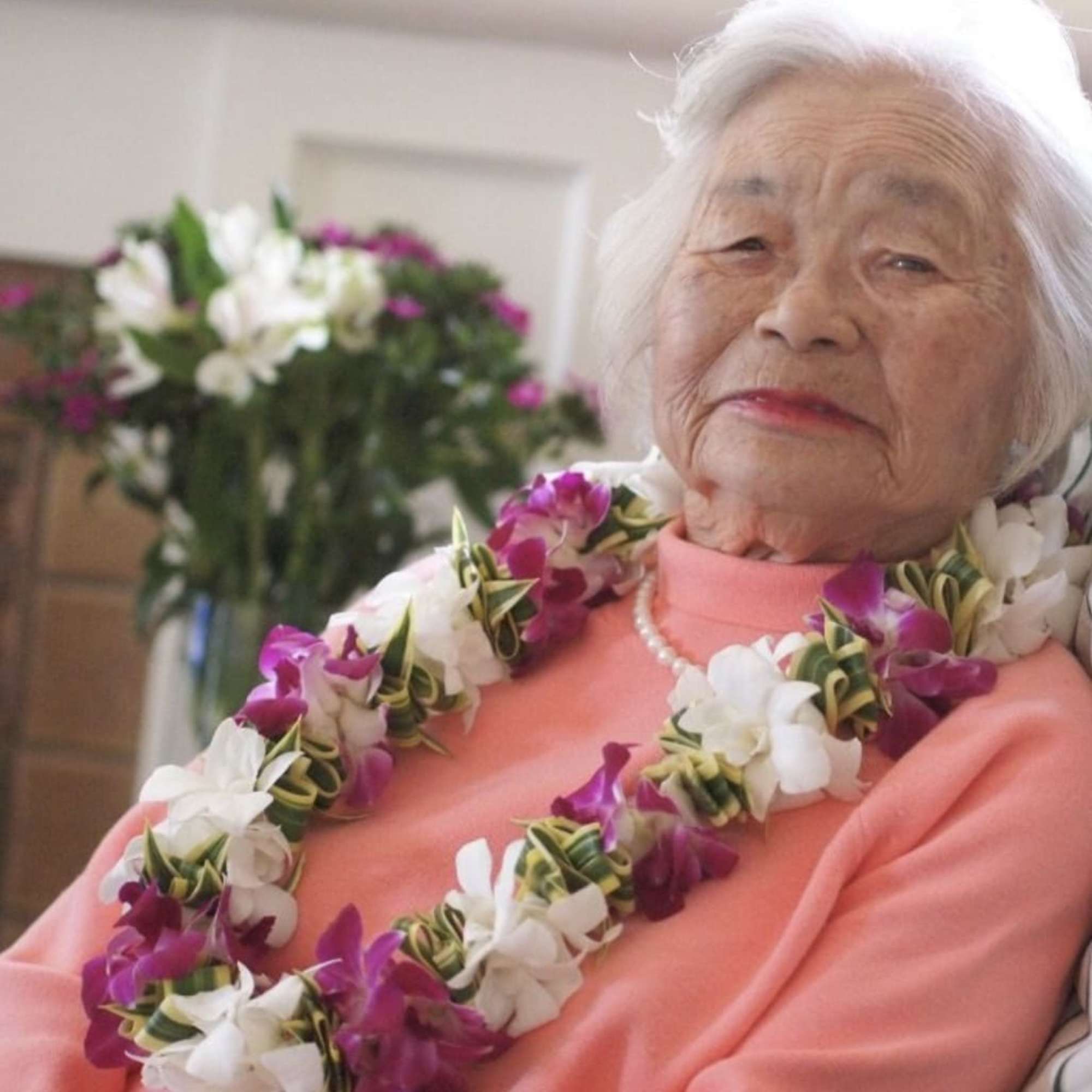 This lei has the beautiful leaf, Song of India, strung in between, photo 2 of 2