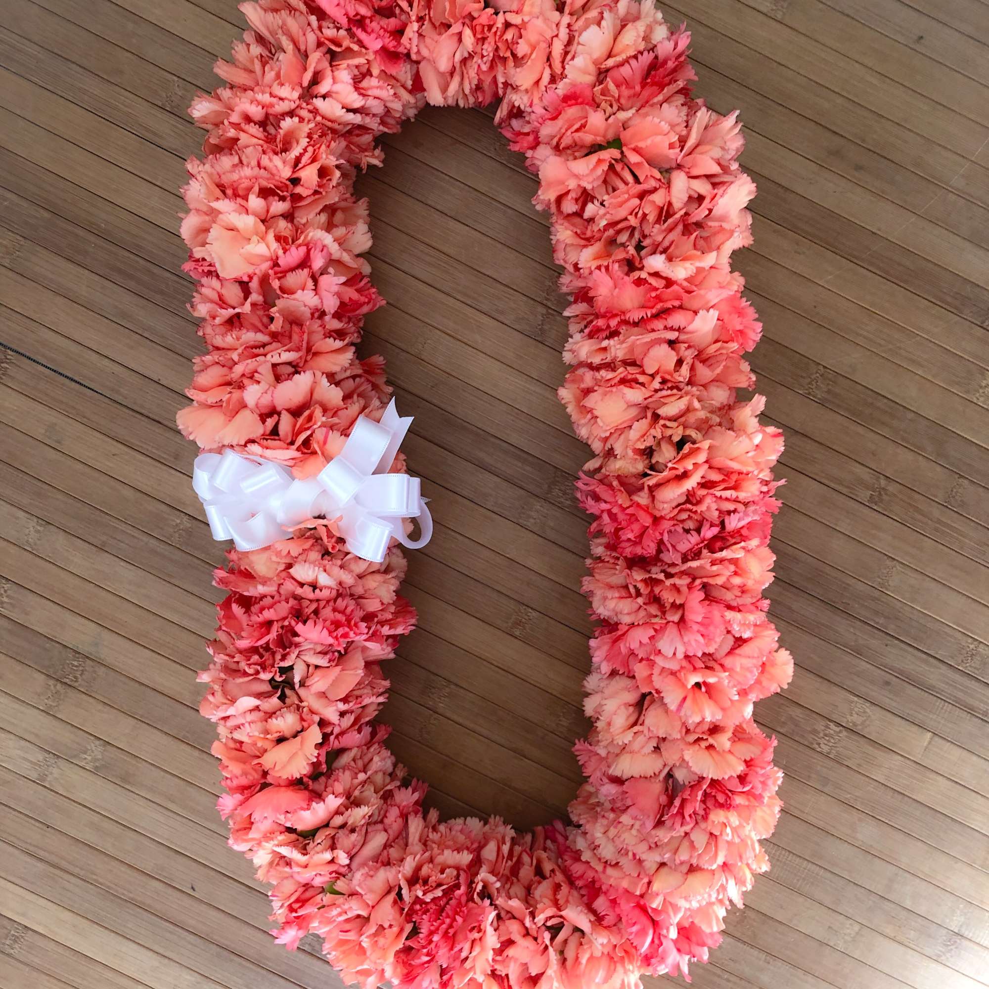This beautiful and full carnation lei is a popular choice for a, photo 4 of 5