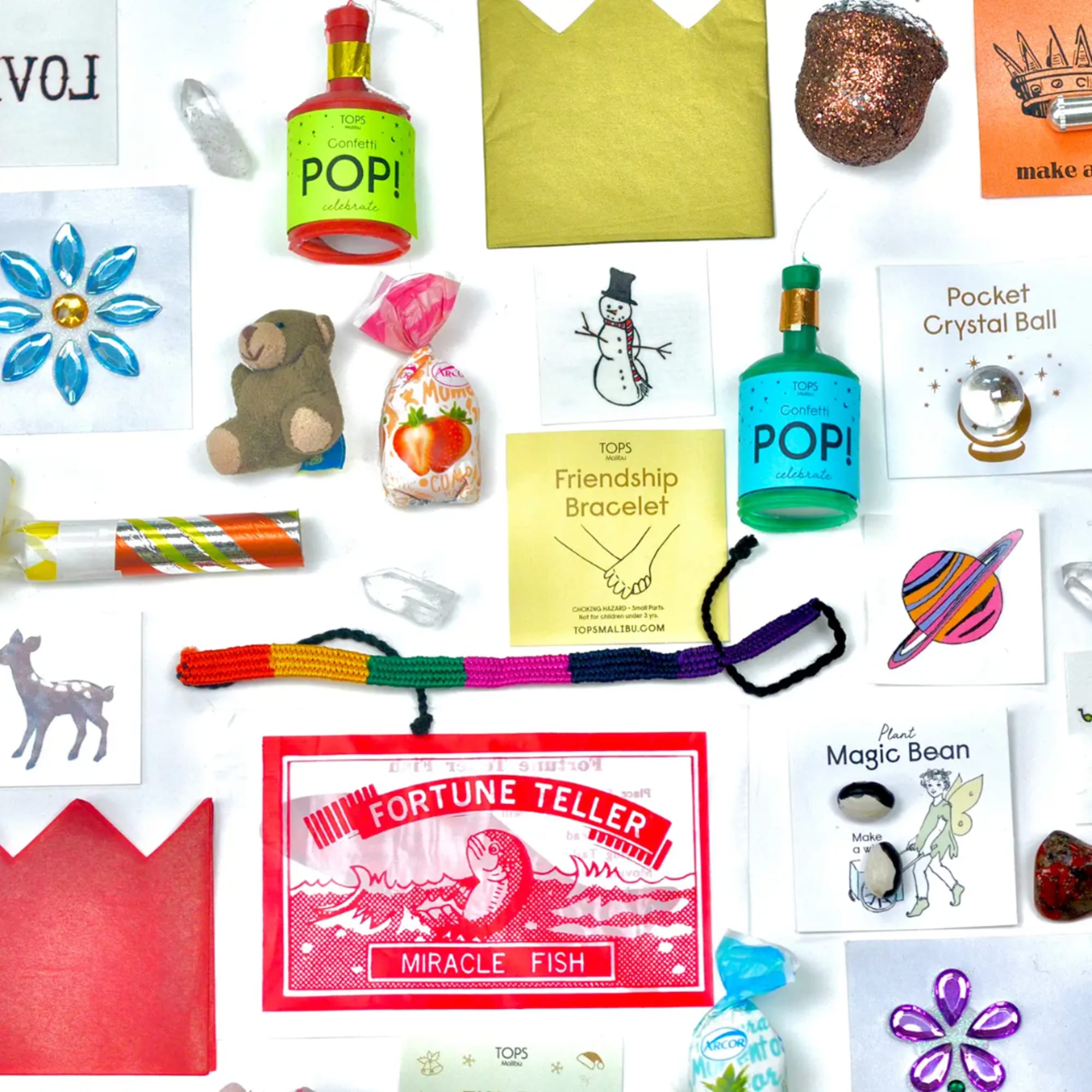 Assorted small novelty gift items and cards arranged on a white background.