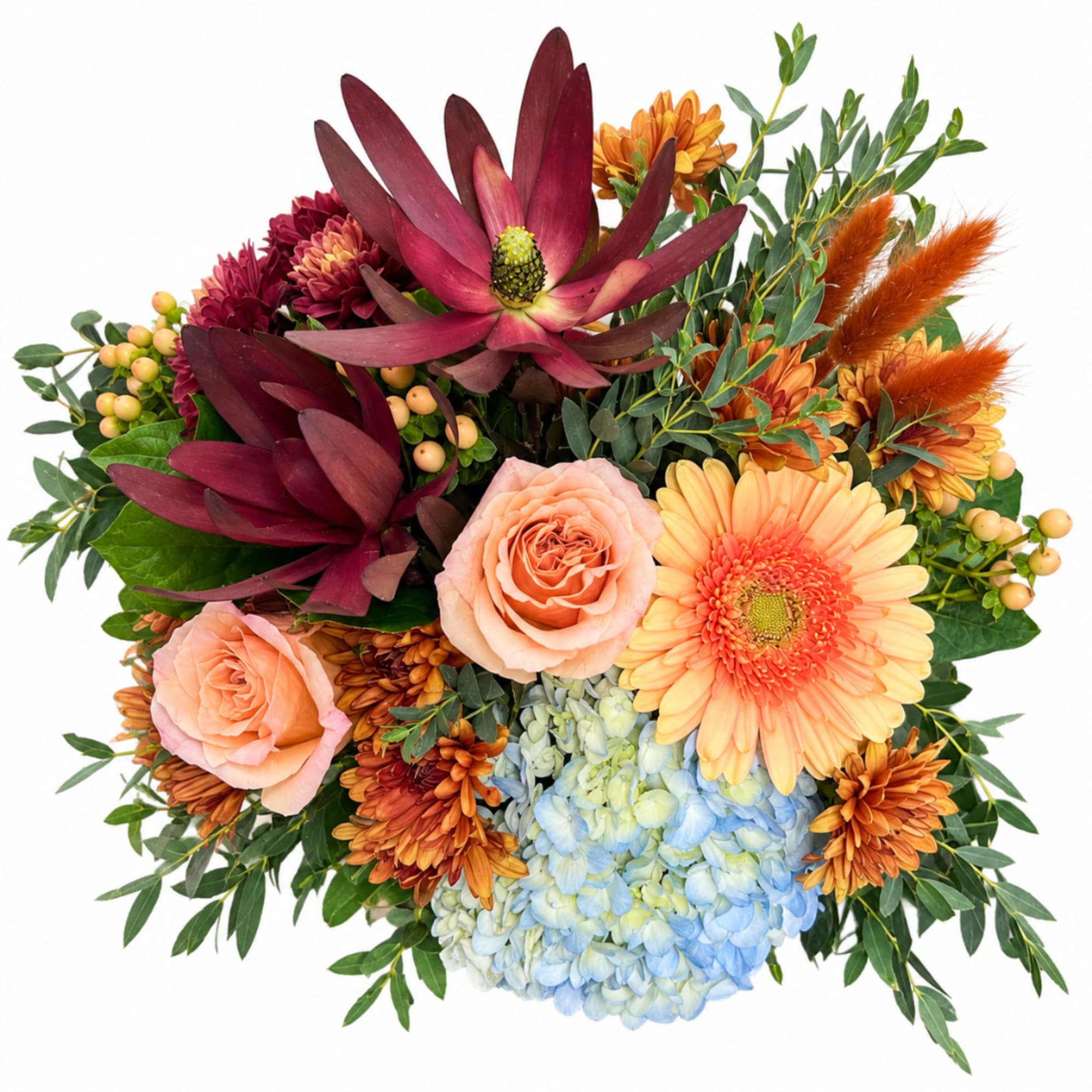 Mixed bouquet with peach roses, gerbera daisies, hydrangea, and burgundy blooms