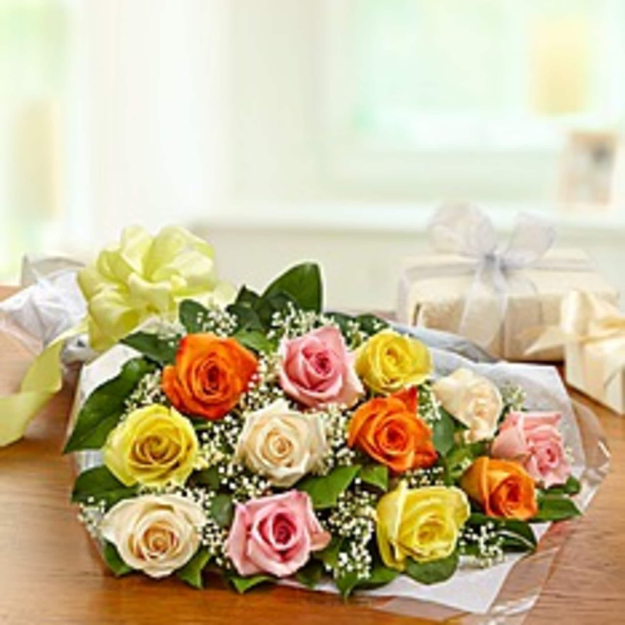 Bouquet of multicolored roses wrapped in clear paper