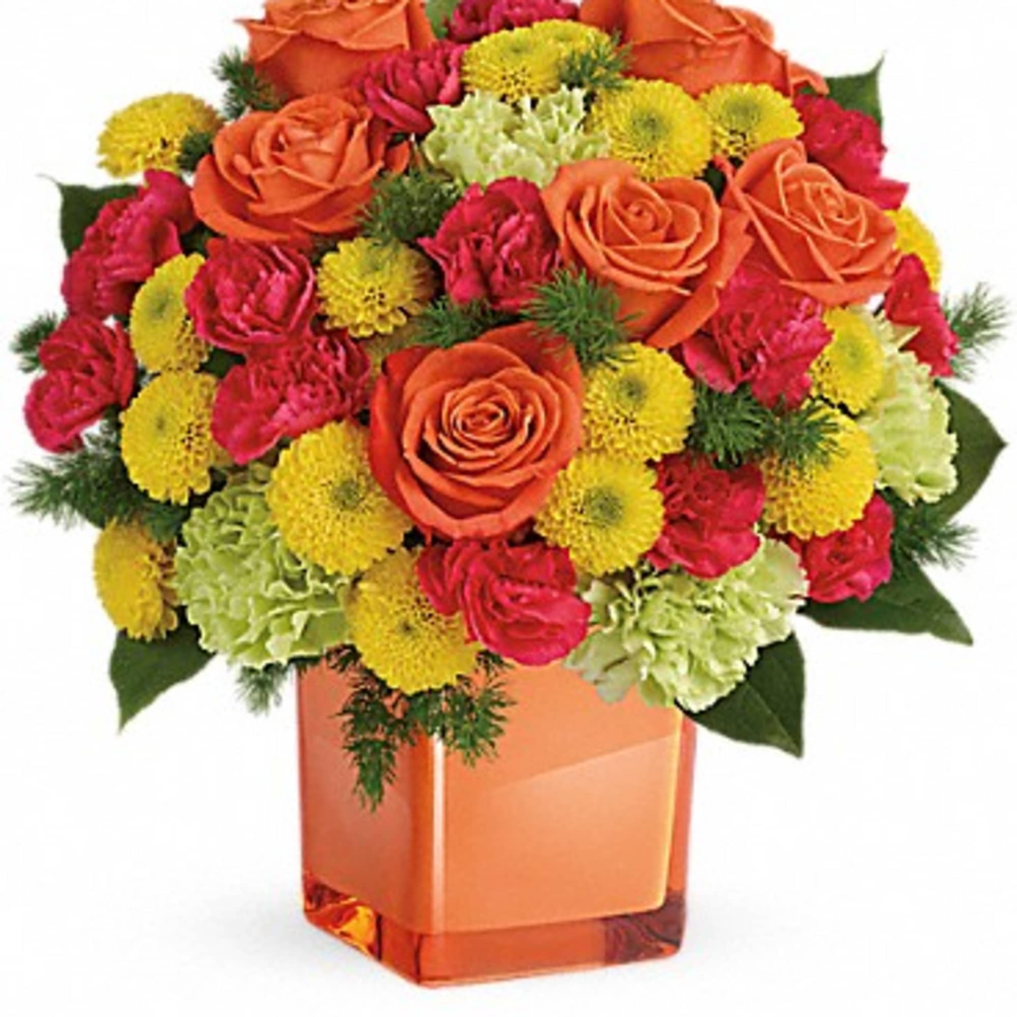 Orange roses with pink and yellow flowers in a square vase