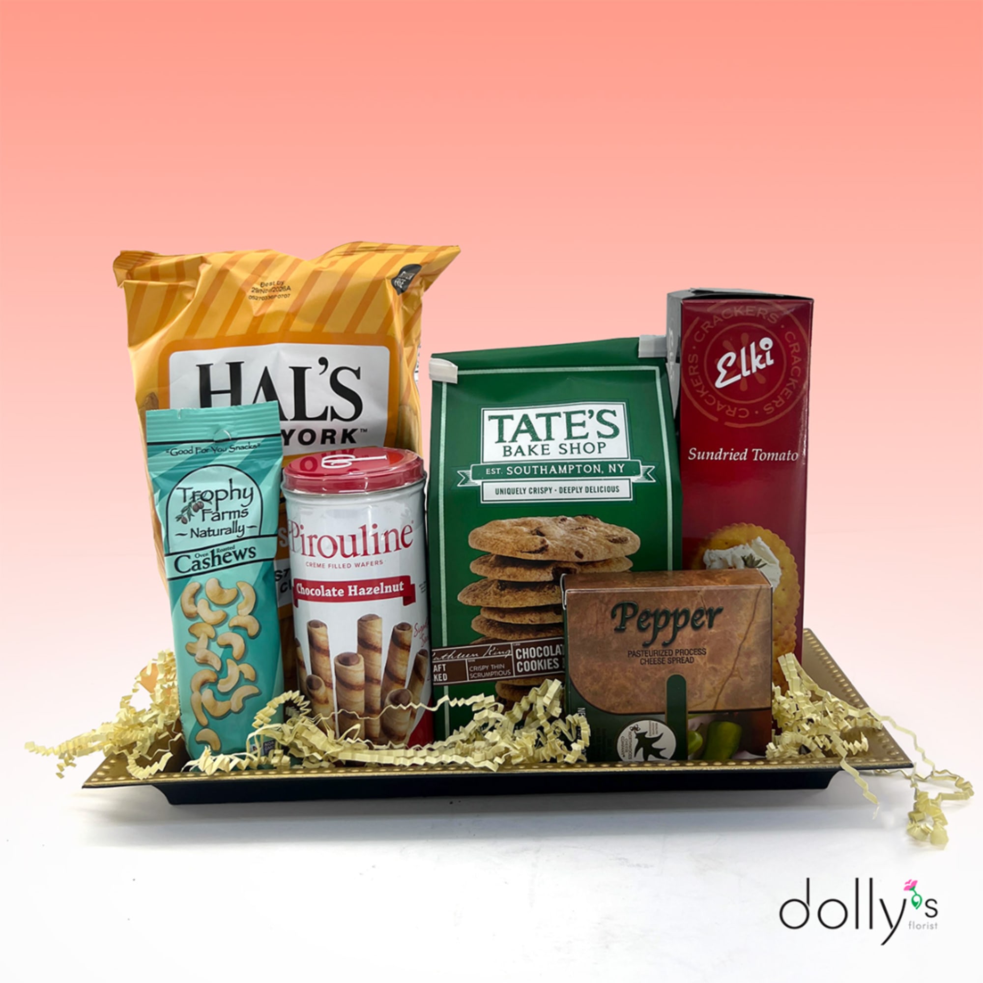 Gift tray with assorted snack packages and a cheese spread box