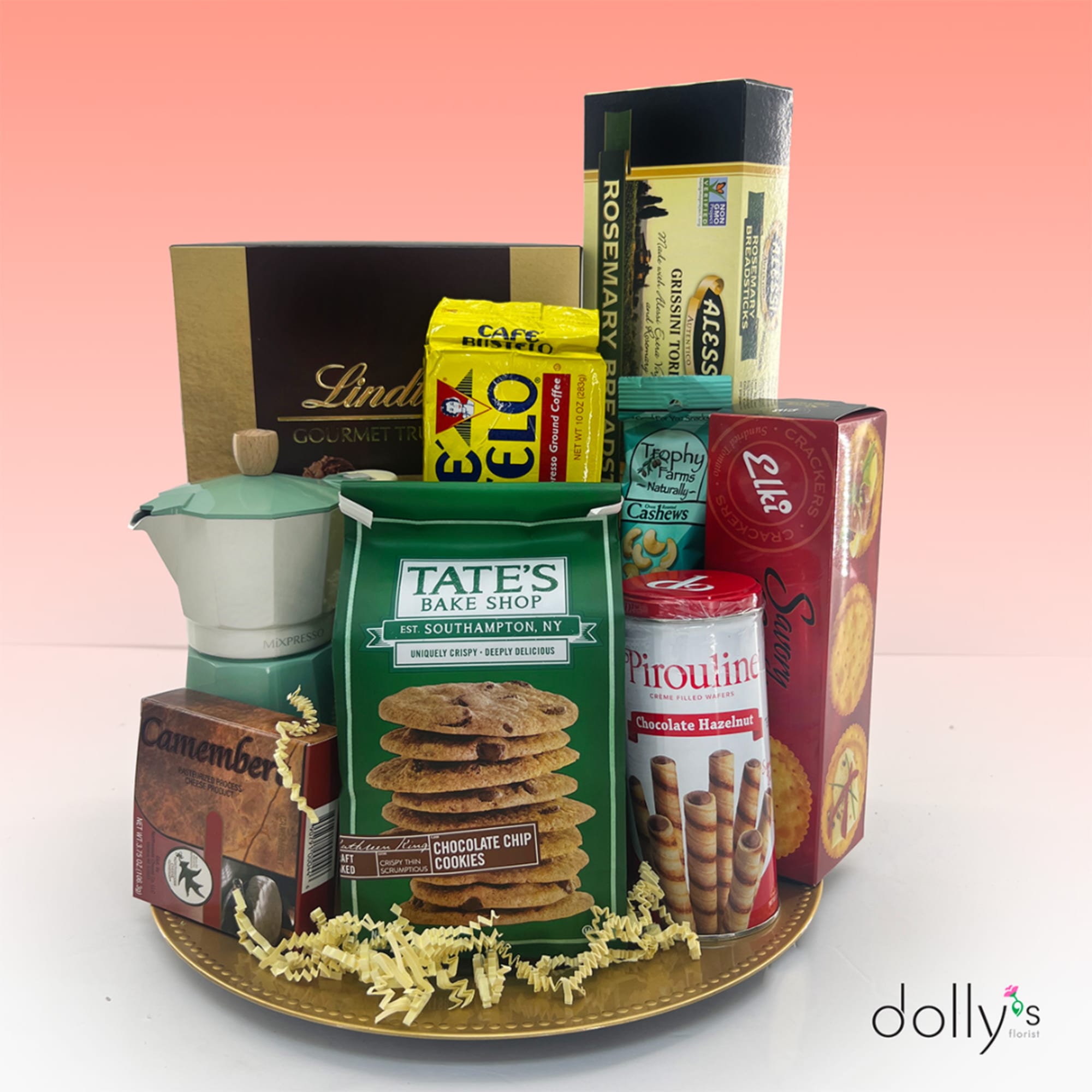 Assorted snack gift basket on a gold tray with cookie and coffee packages