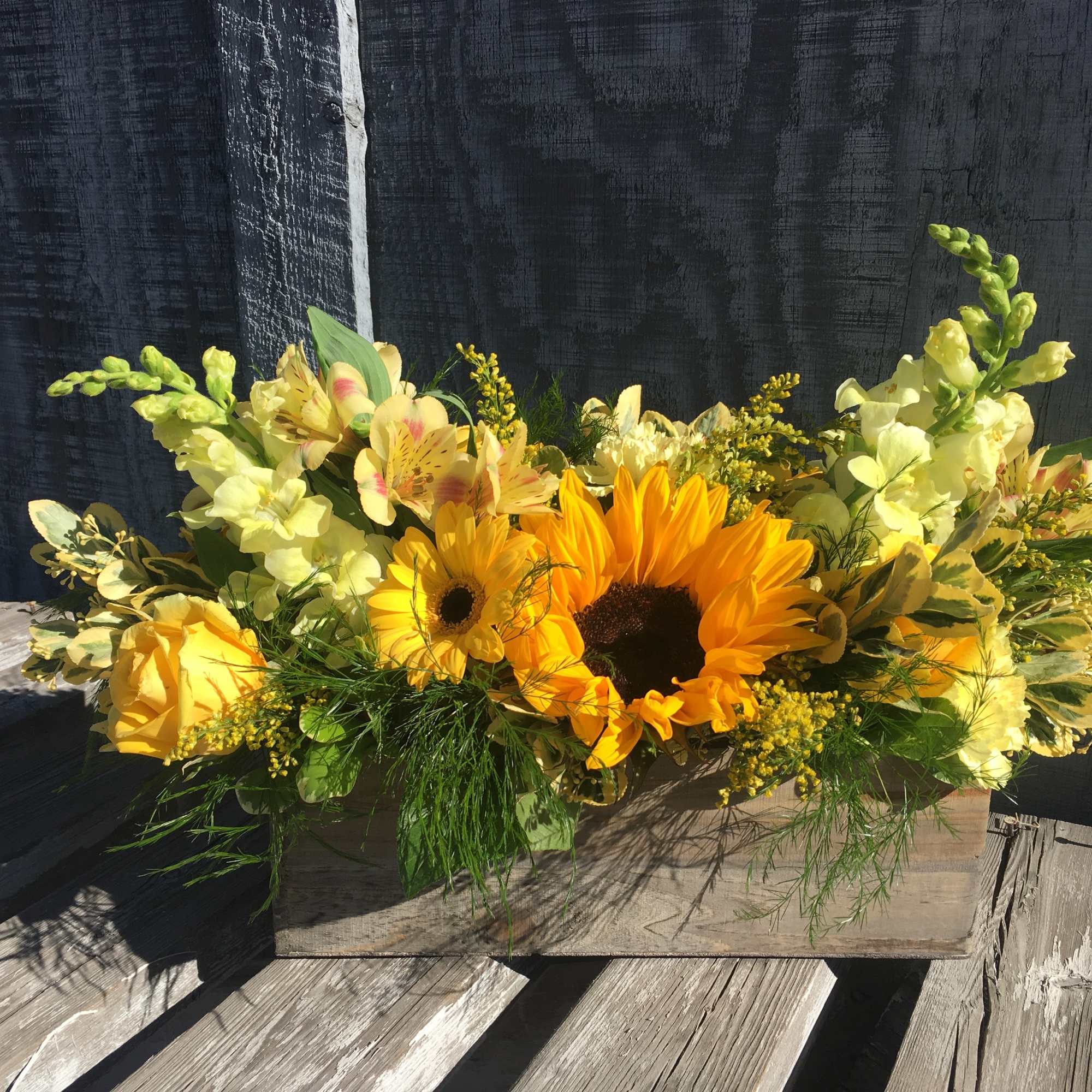 A bright and full beautiful array of yellow and orange flowers in