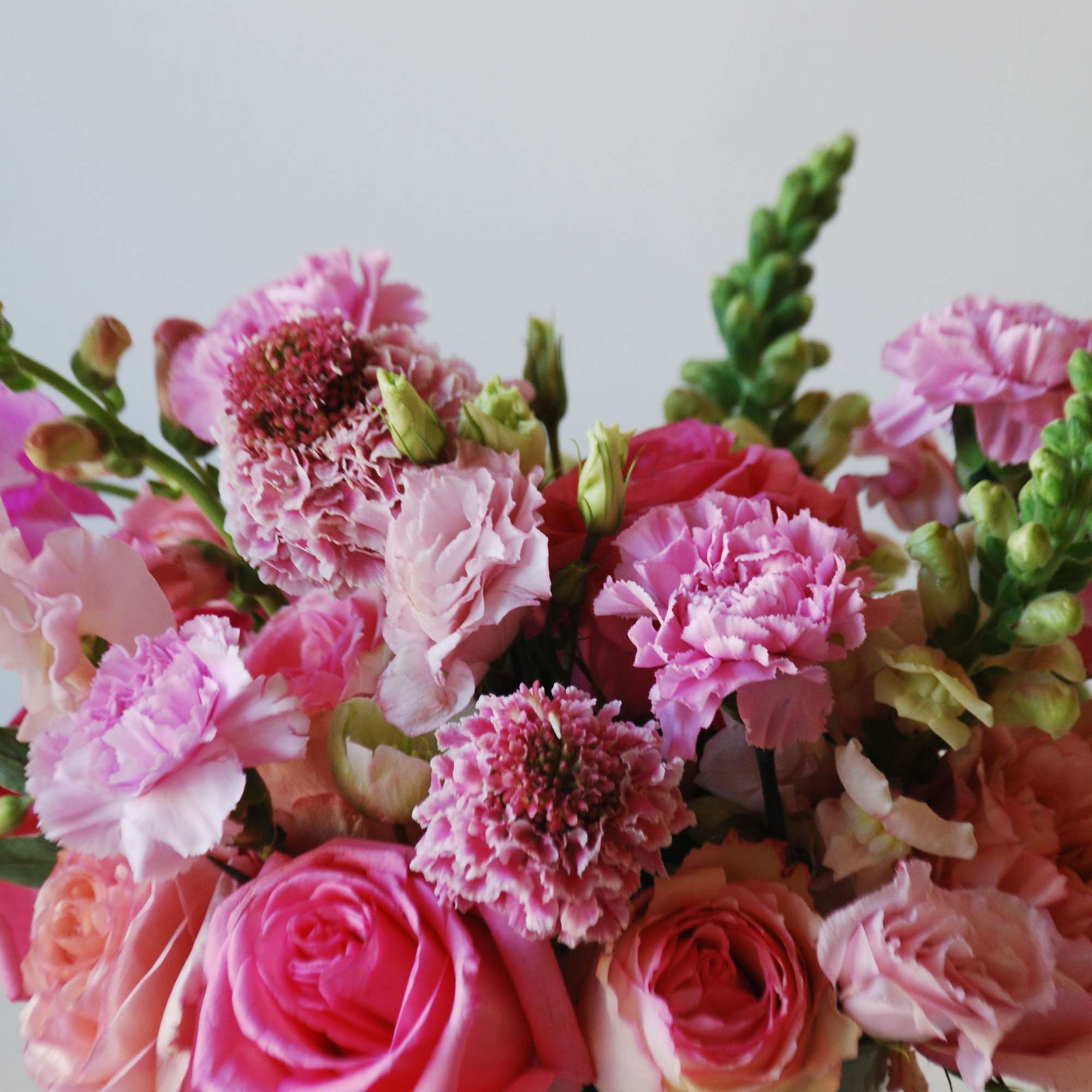 Pink bouquet with roses, carnations, and snapdragons