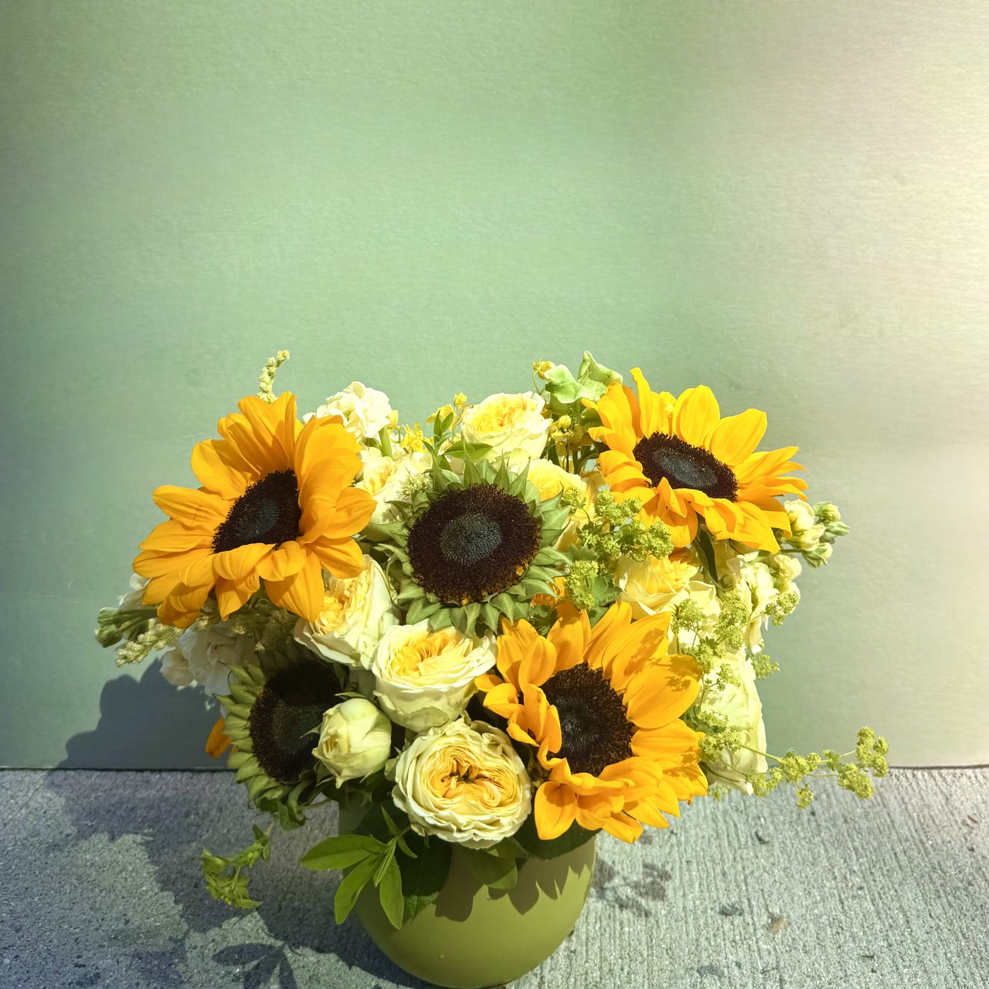 Golden sunflowers take center stage in this sunflower arrangement for birthdays, thank-yous