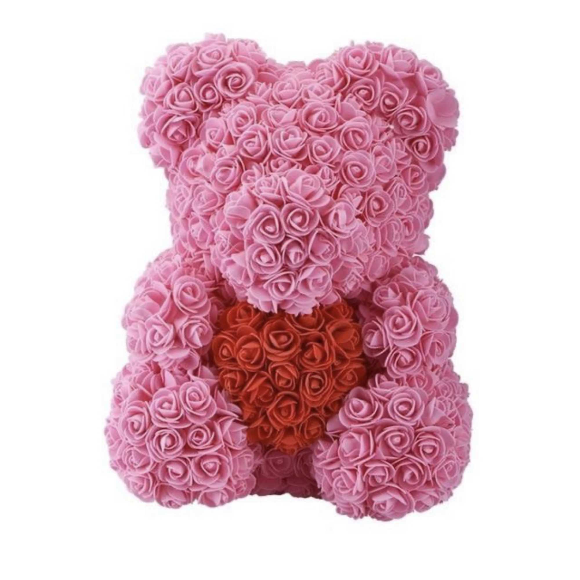 Pink rose teddy bear figure holding a red rose heart