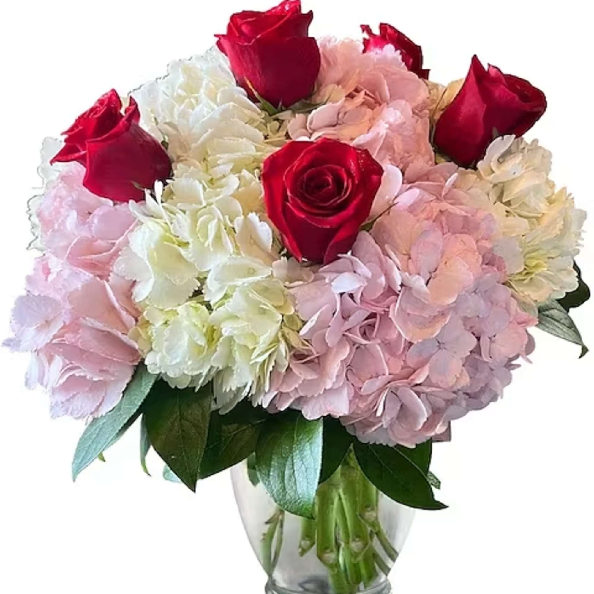 Bouquet of red roses and pink-white hydrangeas in a clear glass vase