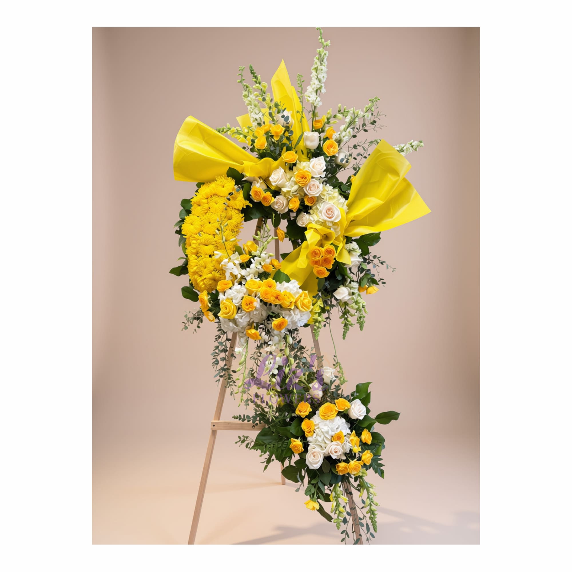 Tall yellow and white floral standing arrangement on an easel