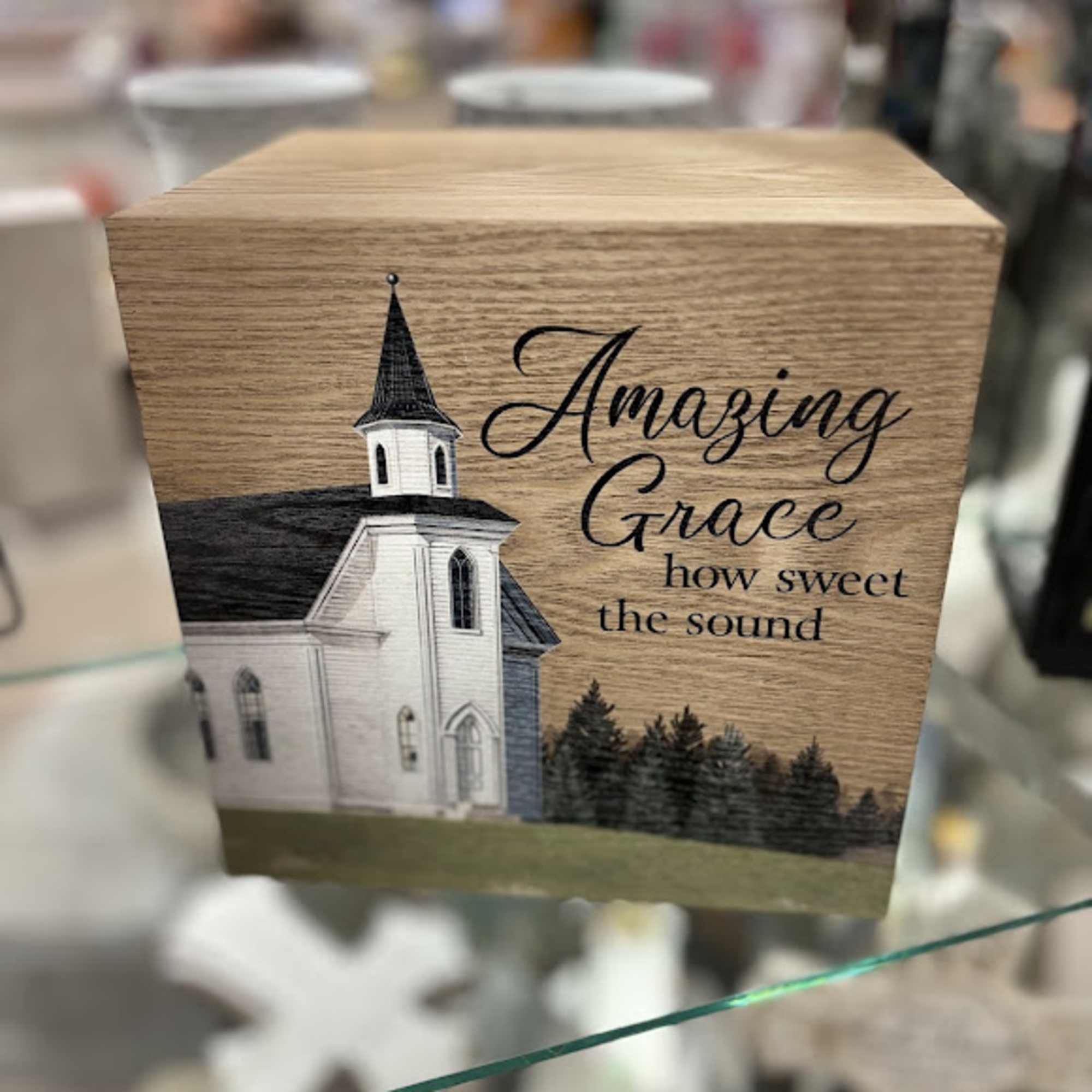 Wooden box with a church illustration and the words "Amazing Grace"