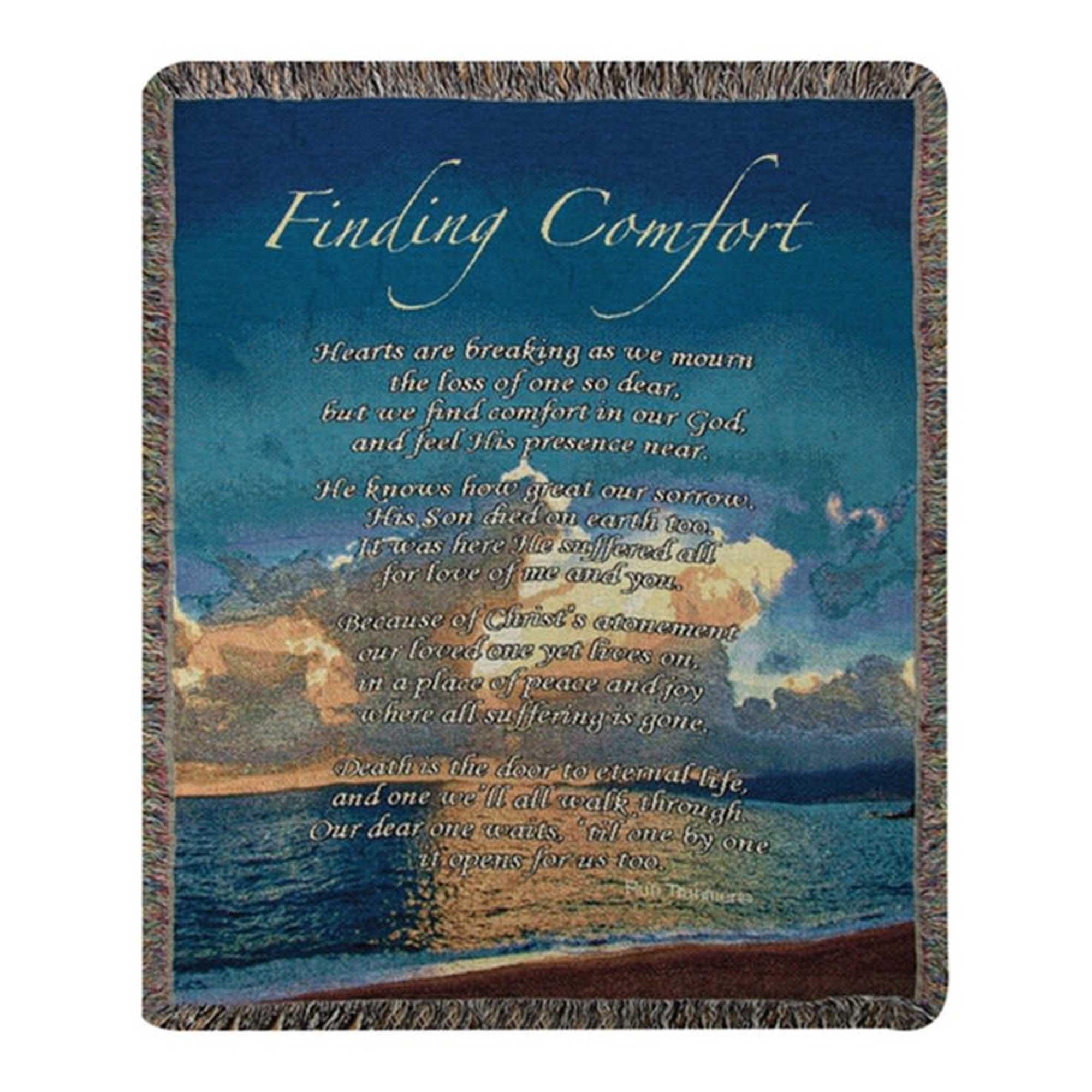 A woven blanket with the words "Finding Comfort" over a seascape.
