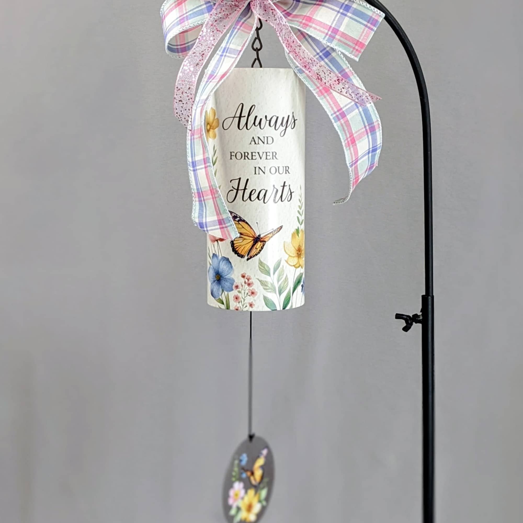 Decorative hanging memorial sign with a plaid bow and butterfly charm