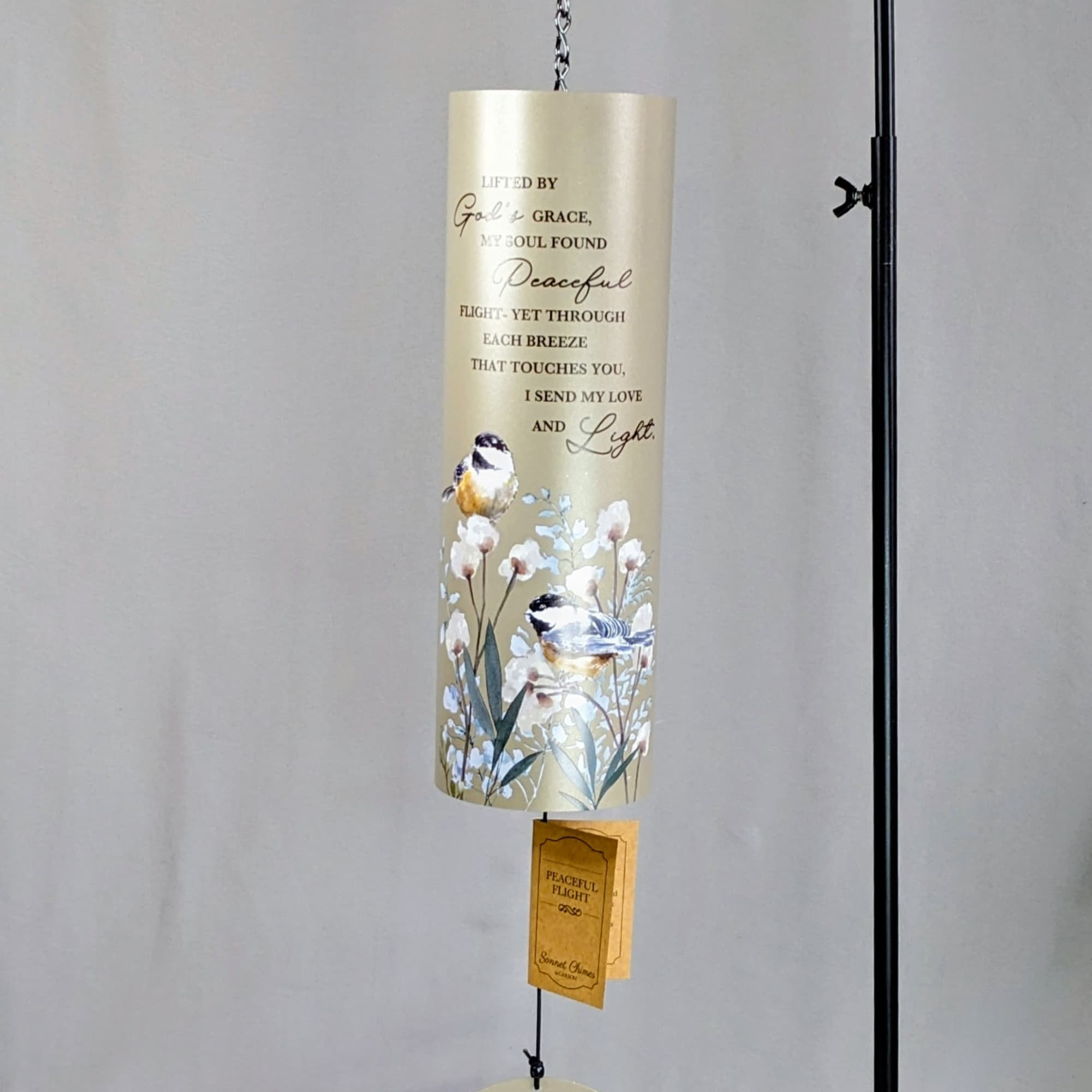 Hanging memorial wind chime with bird and floral artwork