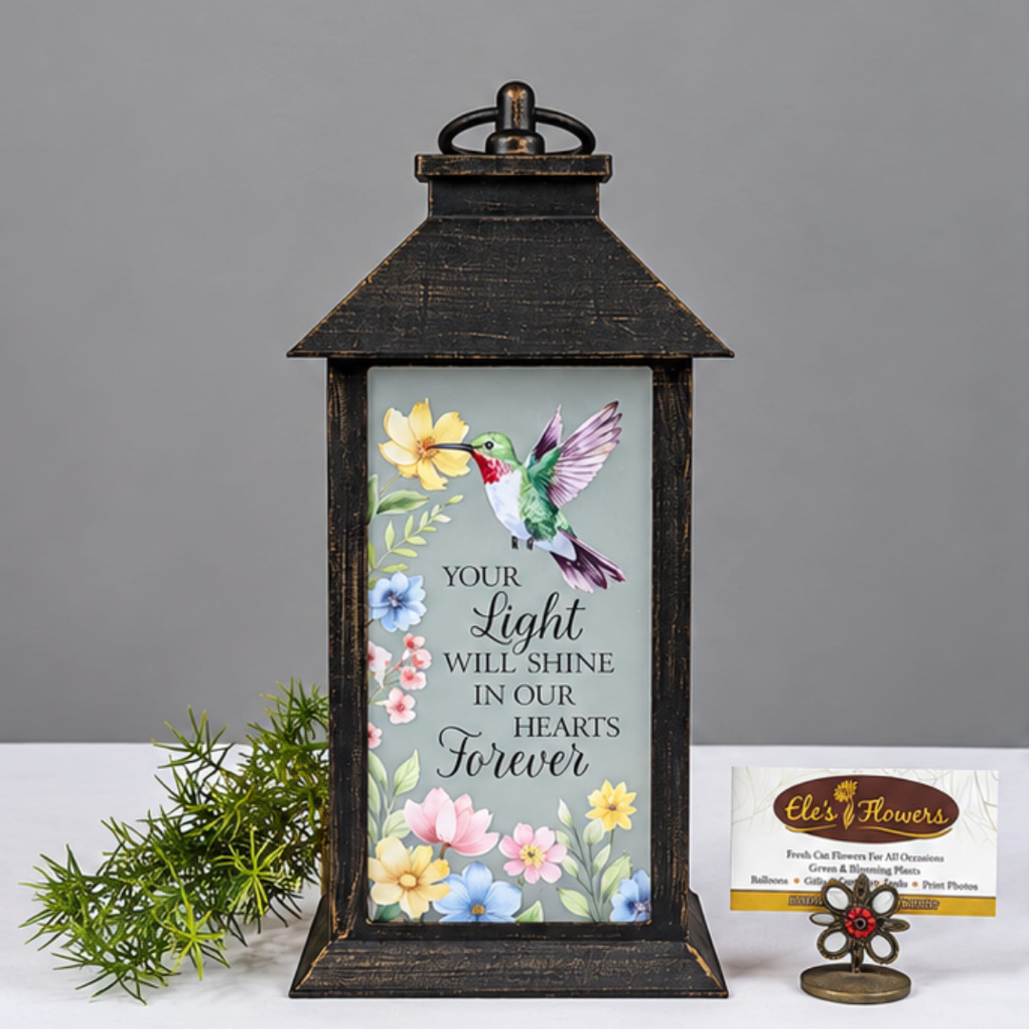 Decorative lantern with a memorial message and floral hummingbird design
