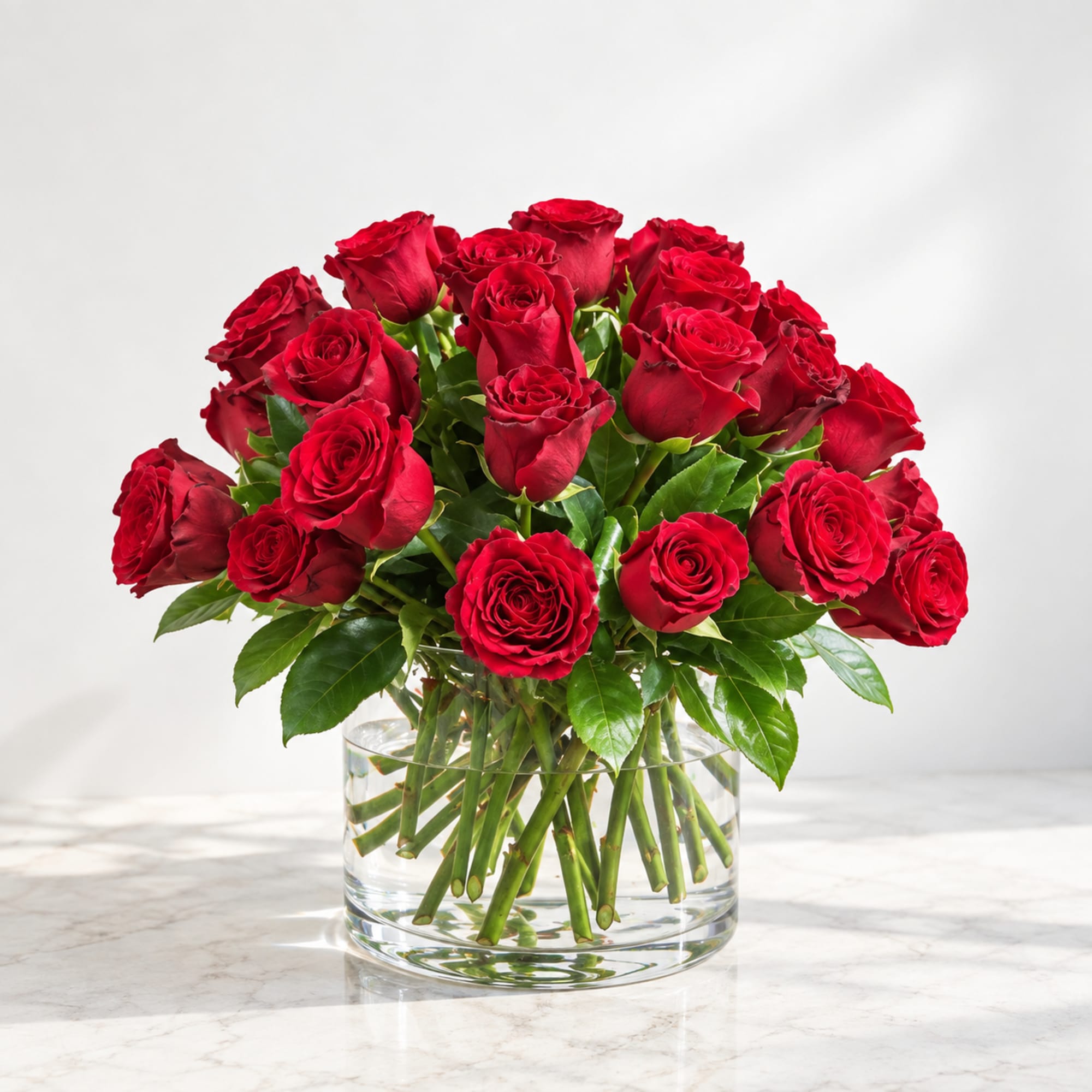 Bouquet of red roses in a clear glass vase