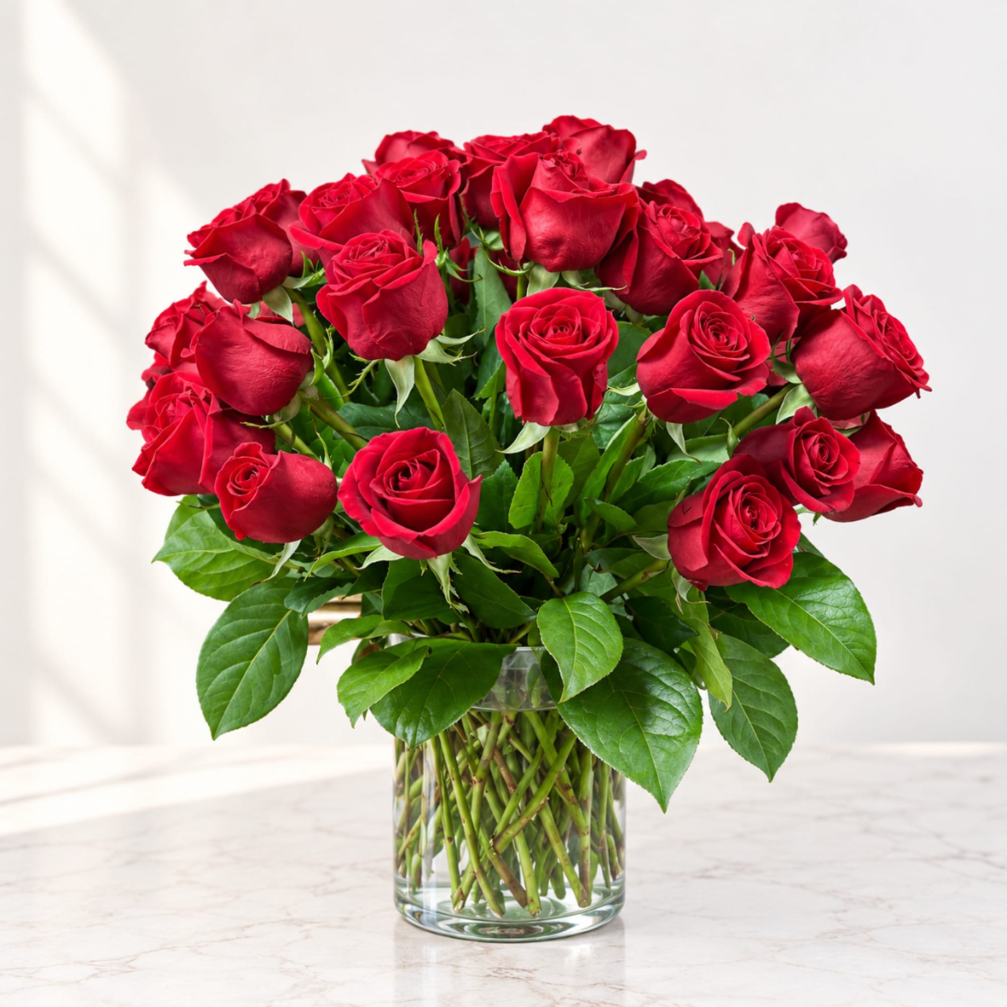 Bouquet of red roses in a clear glass vase