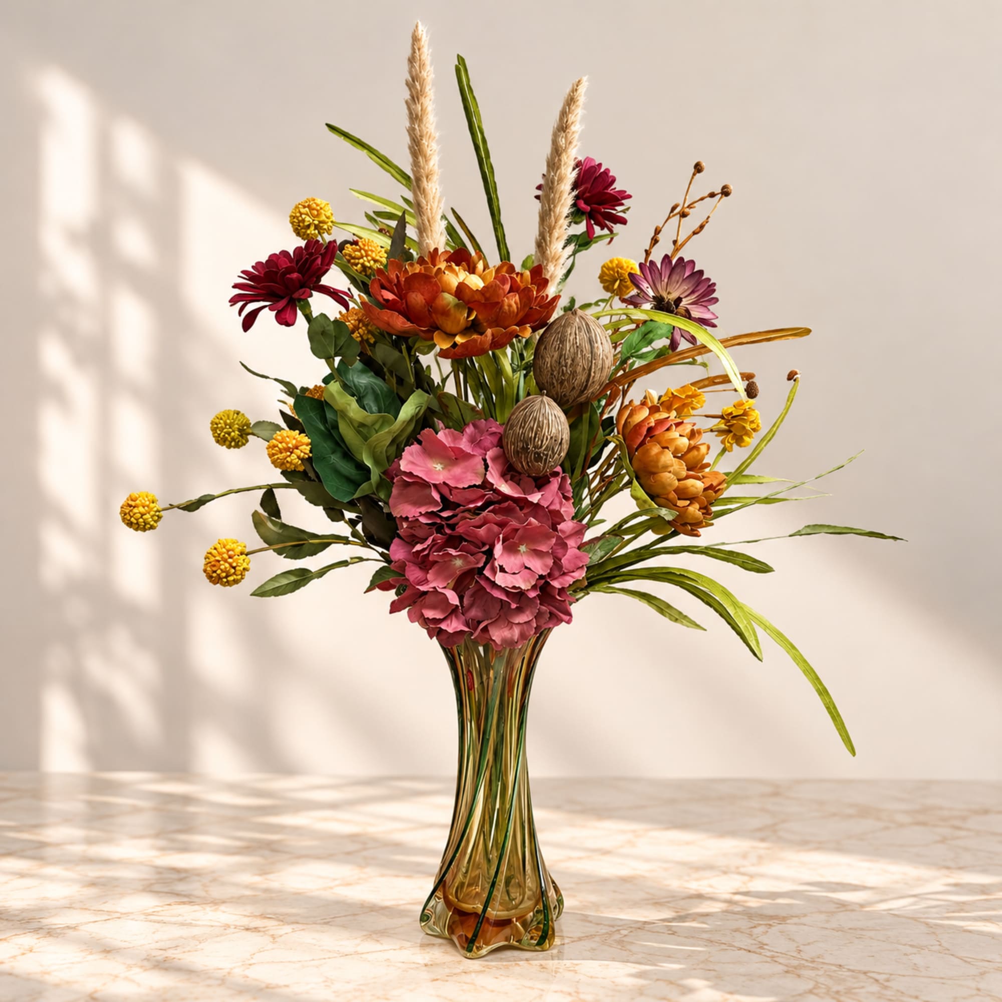Mixed floral arrangement in a tall glass vase with pink, orange, and yellow blooms