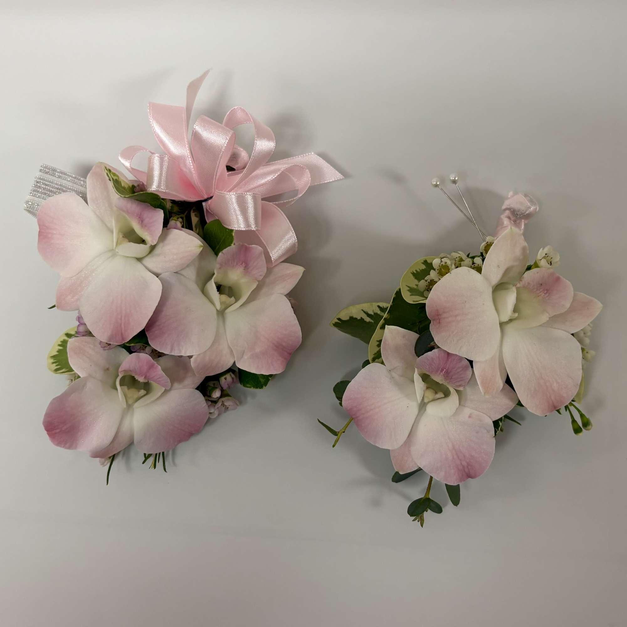 Recipe: Dendrobium Orchid corsage and/or boutonniere. 
Dendrobium orchid colors available: white 