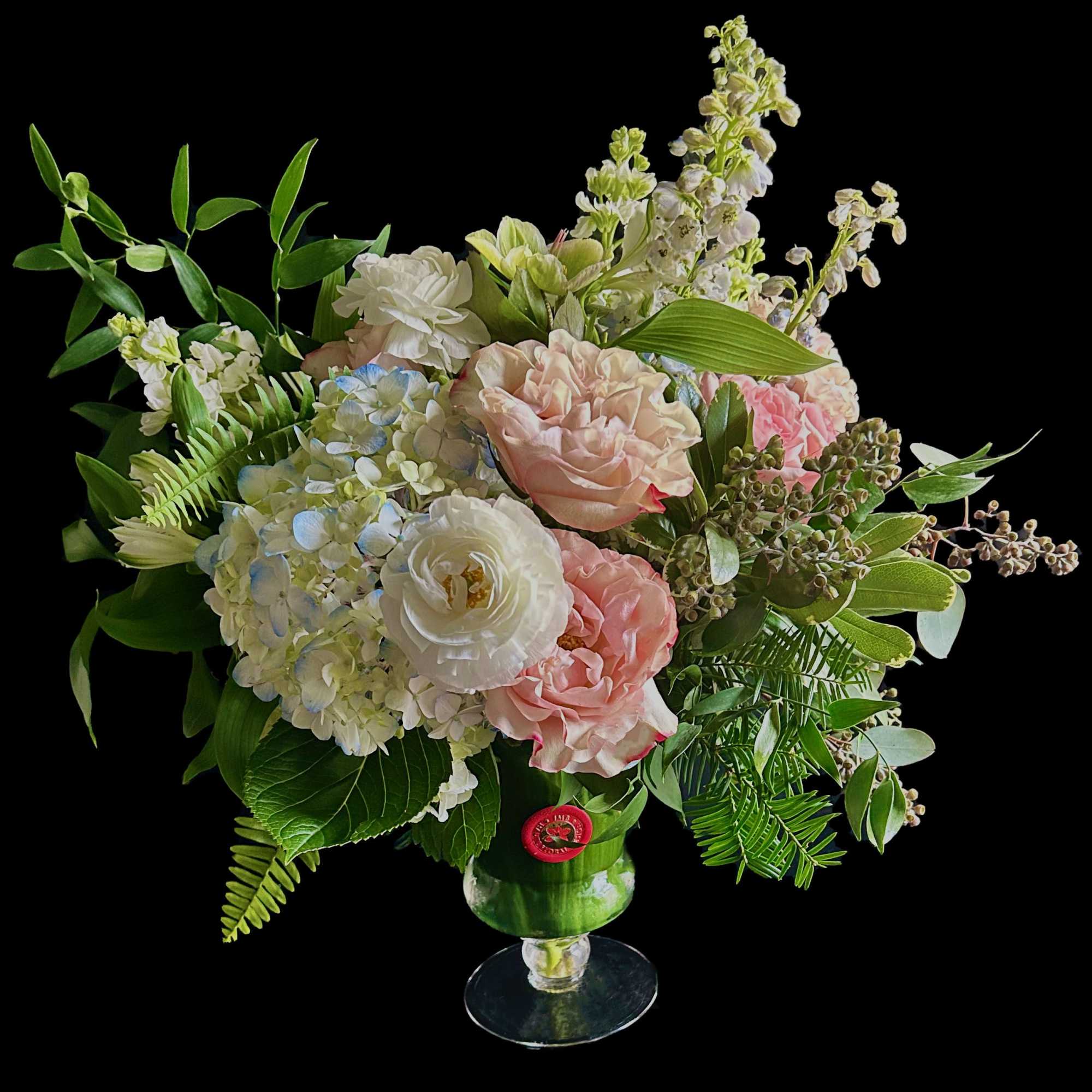 Tall garden style arrangement with premium seasonal blooms in your color palette